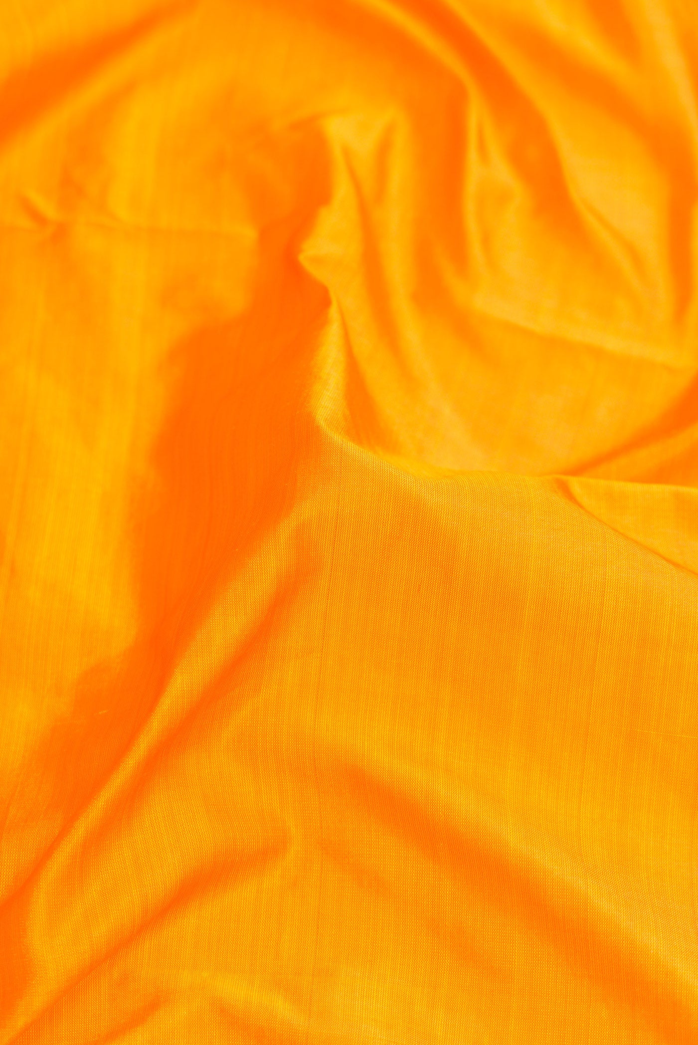 Close up of Yellow Dual Tone Kanjivaram Silk Nine Yards Saree with Plain Body and Zari Border.  displaying folds