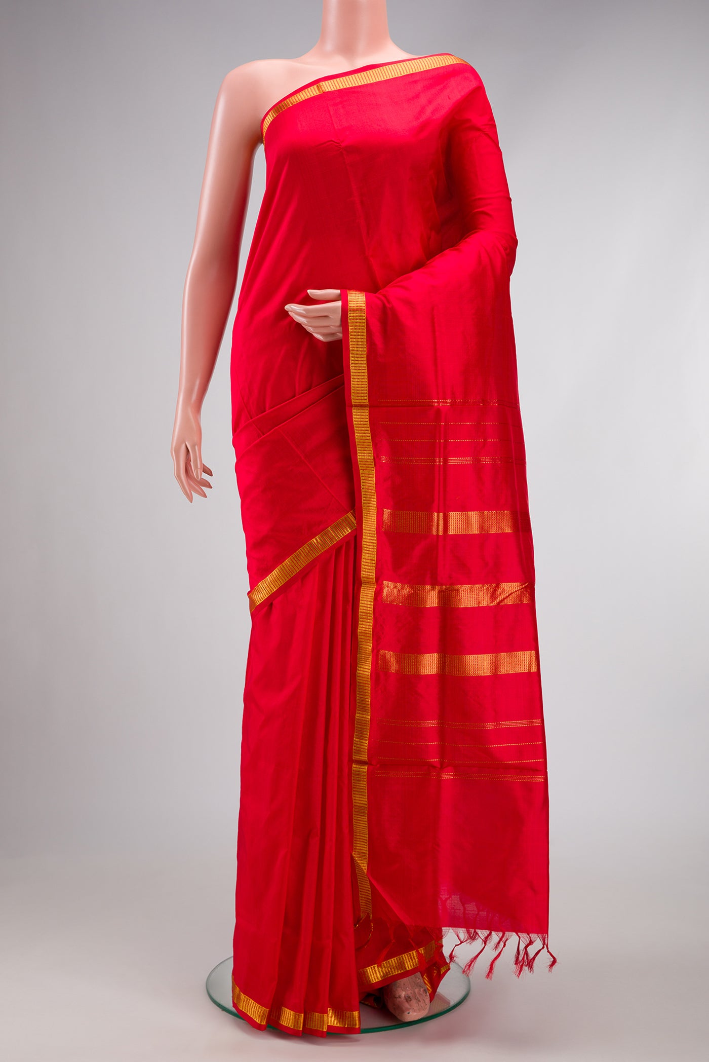 Red Kanjivaram Silk Nine Yards Saree with Plain Body and Zari Border.  displayed on a mannequin