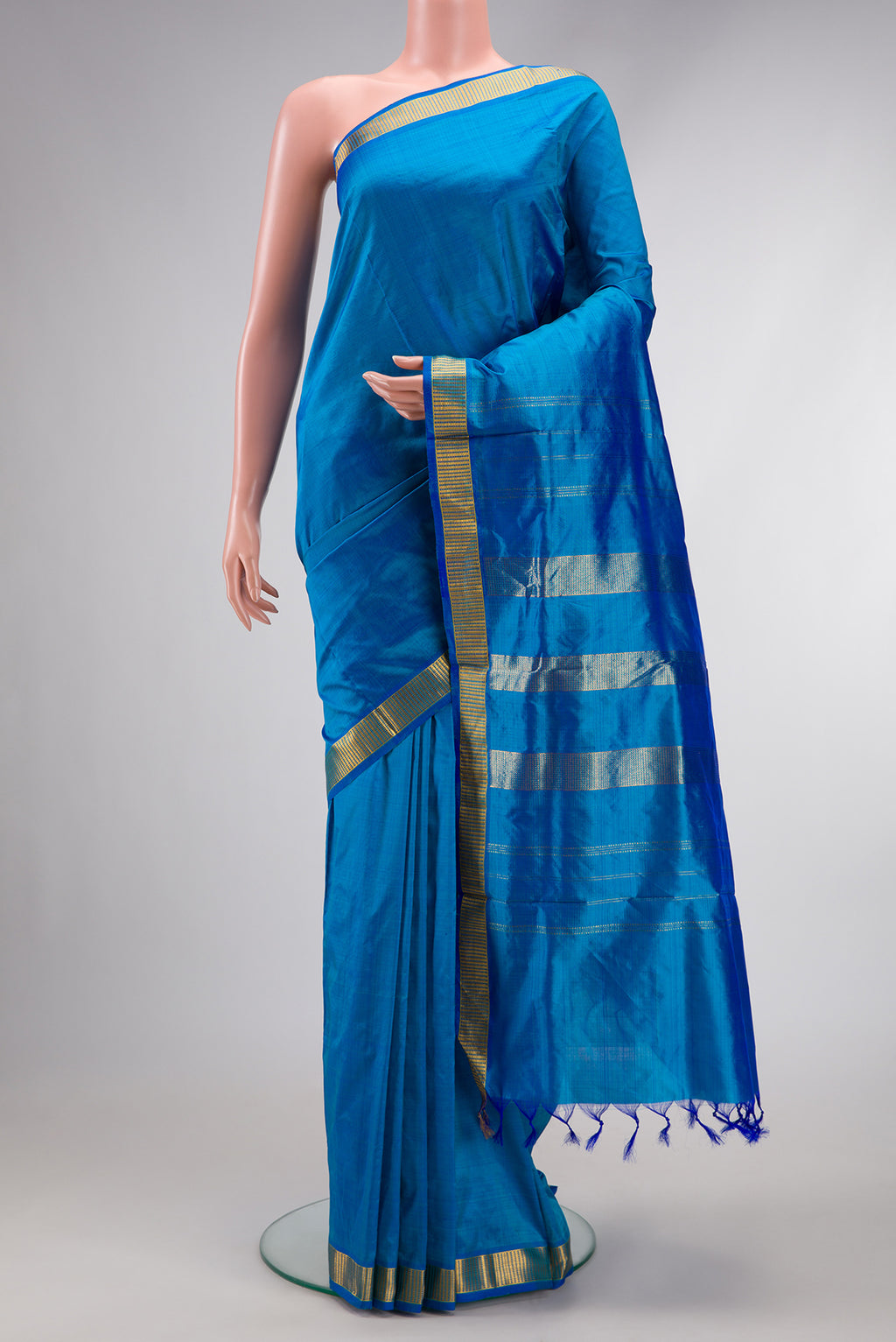 Peacock Blue Dual Tone Kanjivaram Silk Nine Yards Saree with Plain Body and Zari Border.  displayed on a mannequin