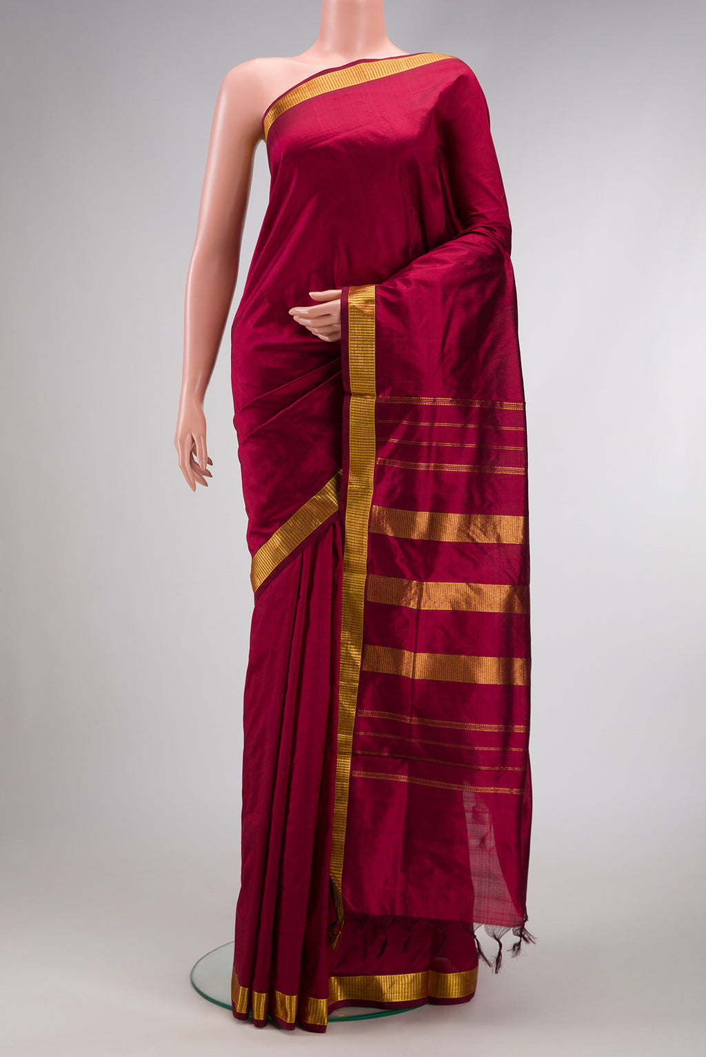 Maroon Dual Tone Kanjivaram Silk Nine Yards Saree with Plain Body and Zari Border.  displayed on a mannequin