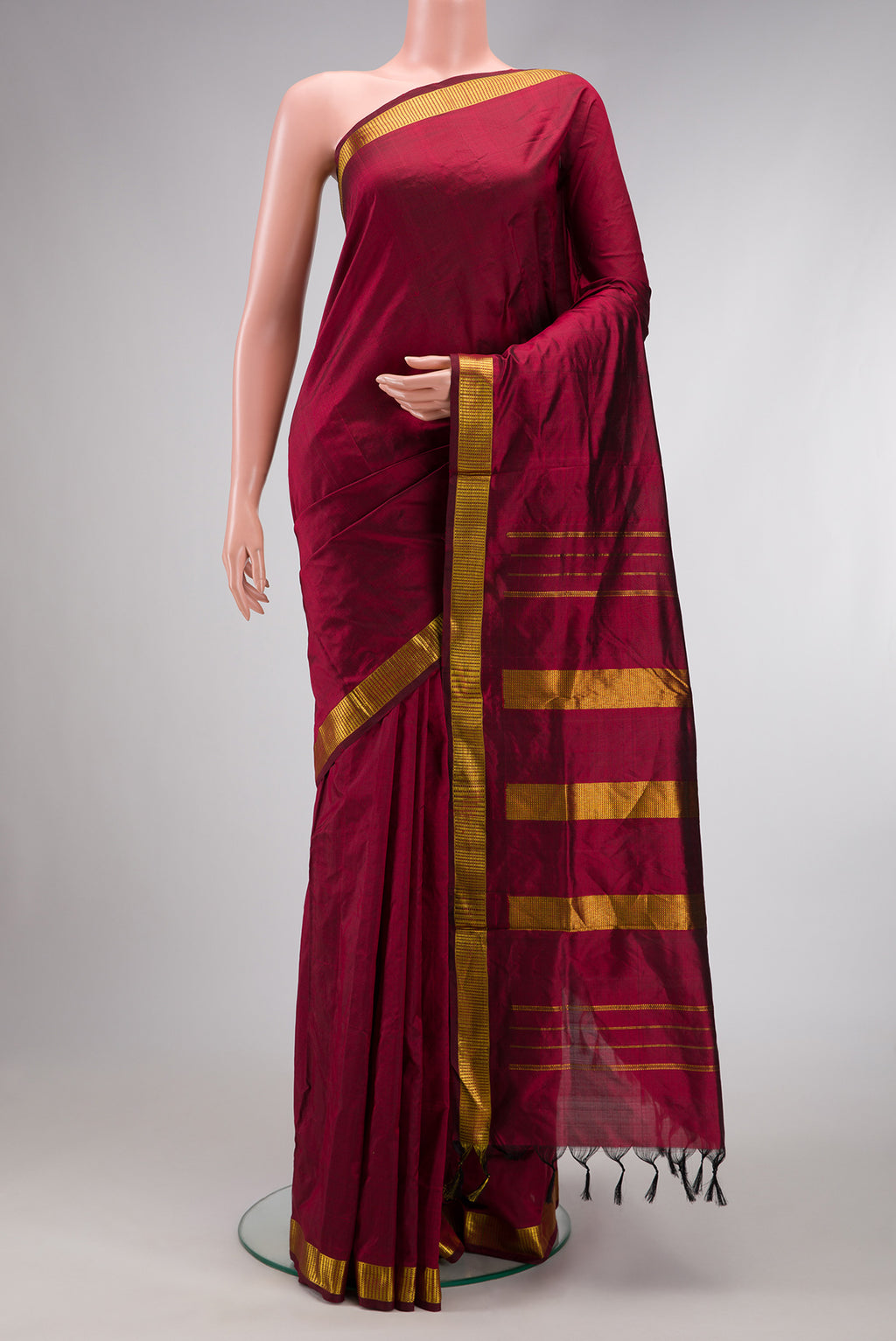 Maroon Dual Tone Kanjivaram Silk Nine Yards Saree with Plain Body and Zari Border.  displayed on a mannequin