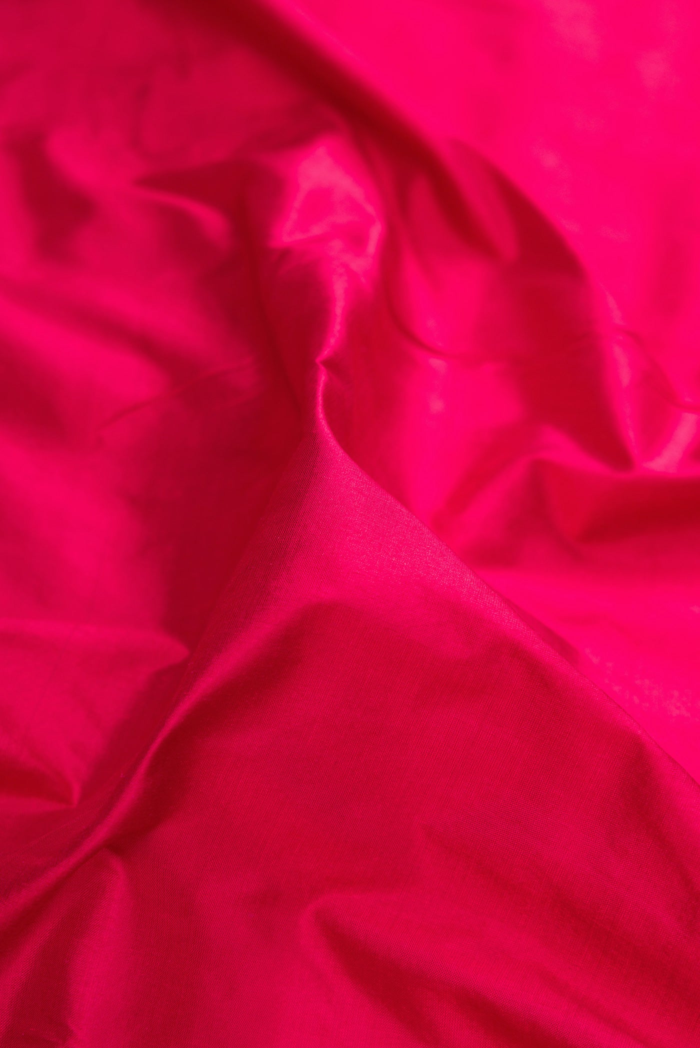 Close up of Maroon Kanchipuram Silk Nine Yards Saree with Plain Body and Zari Border.  displaying folds