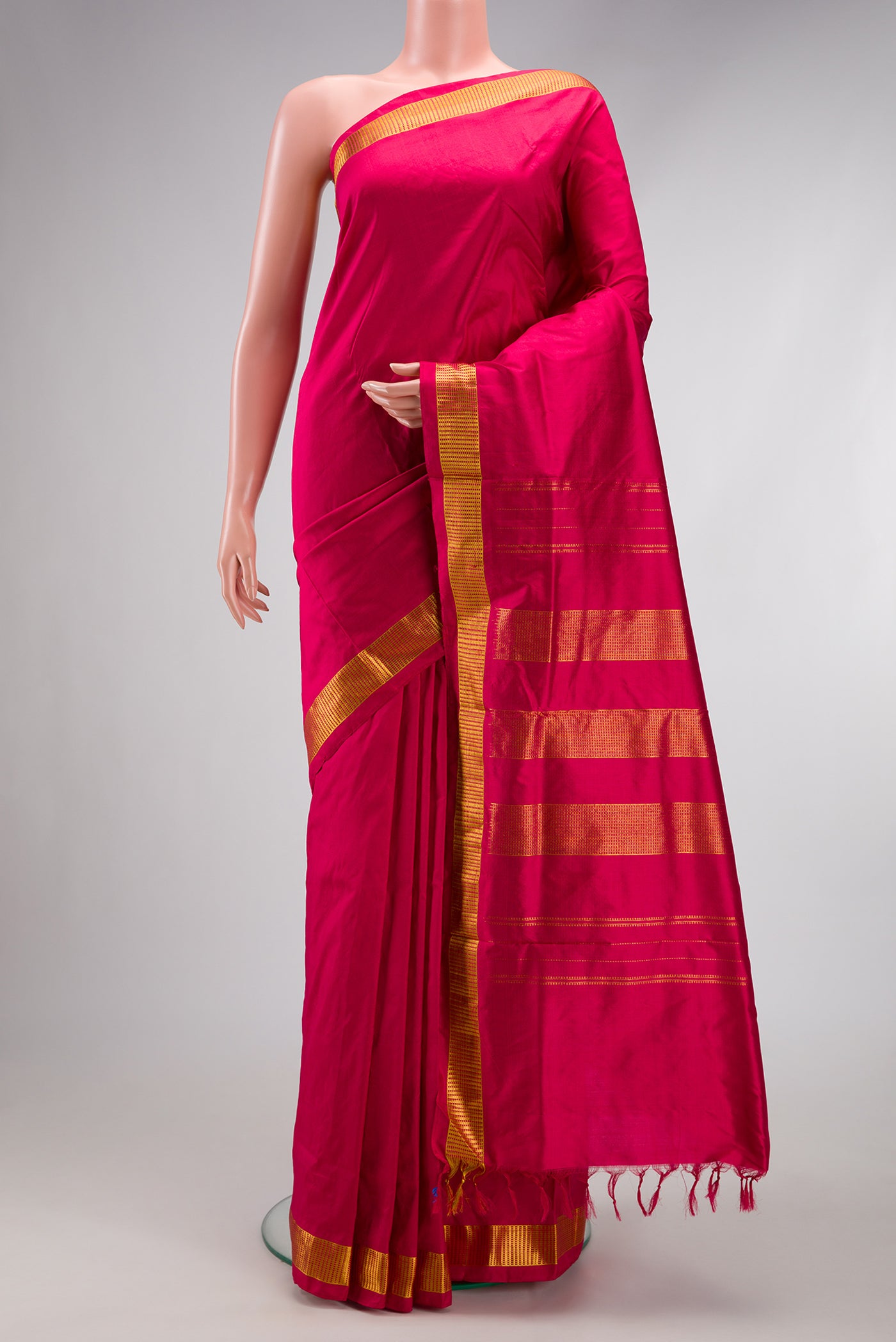 Maroon Kanchipuram Silk Nine Yards Saree with Plain Body and Zari Border.  displayed on a mannequin