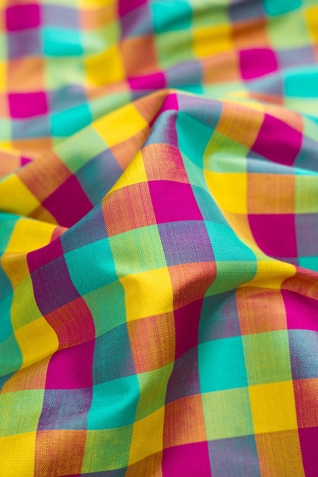Close up of Pure Silk Pure Zari Sea Green , Yellow and Dark PInk Color Kanchipuram Nine Yards Saree with Checked design on the body and Zari Border.  displaying folds