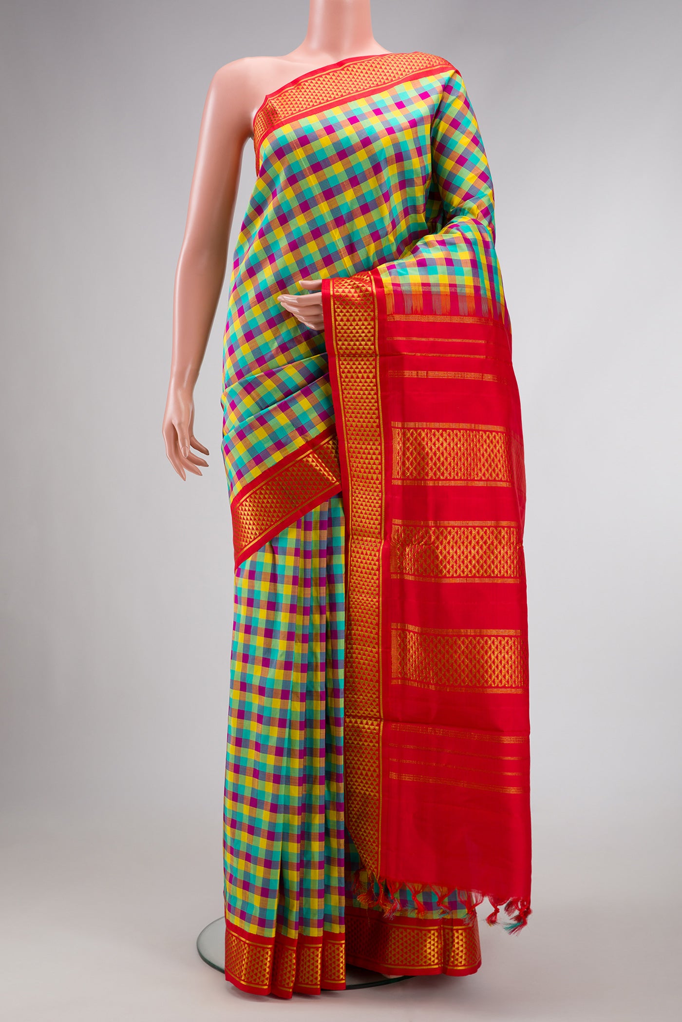 Pure Silk Pure Zari Sea Green , Yellow and Dark PInk Color Kanchipuram Nine Yards Saree with Checked design on the body and Zari Border.  displayed on a mannequin