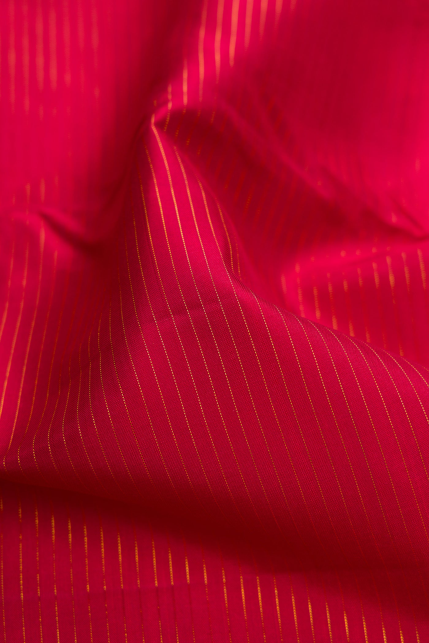 Close up of Pure Silk Pure Zari Maroon Dual Tone Kanchipuram Nine Yards Saree with Plain Body and Zari Border.  displaying folds