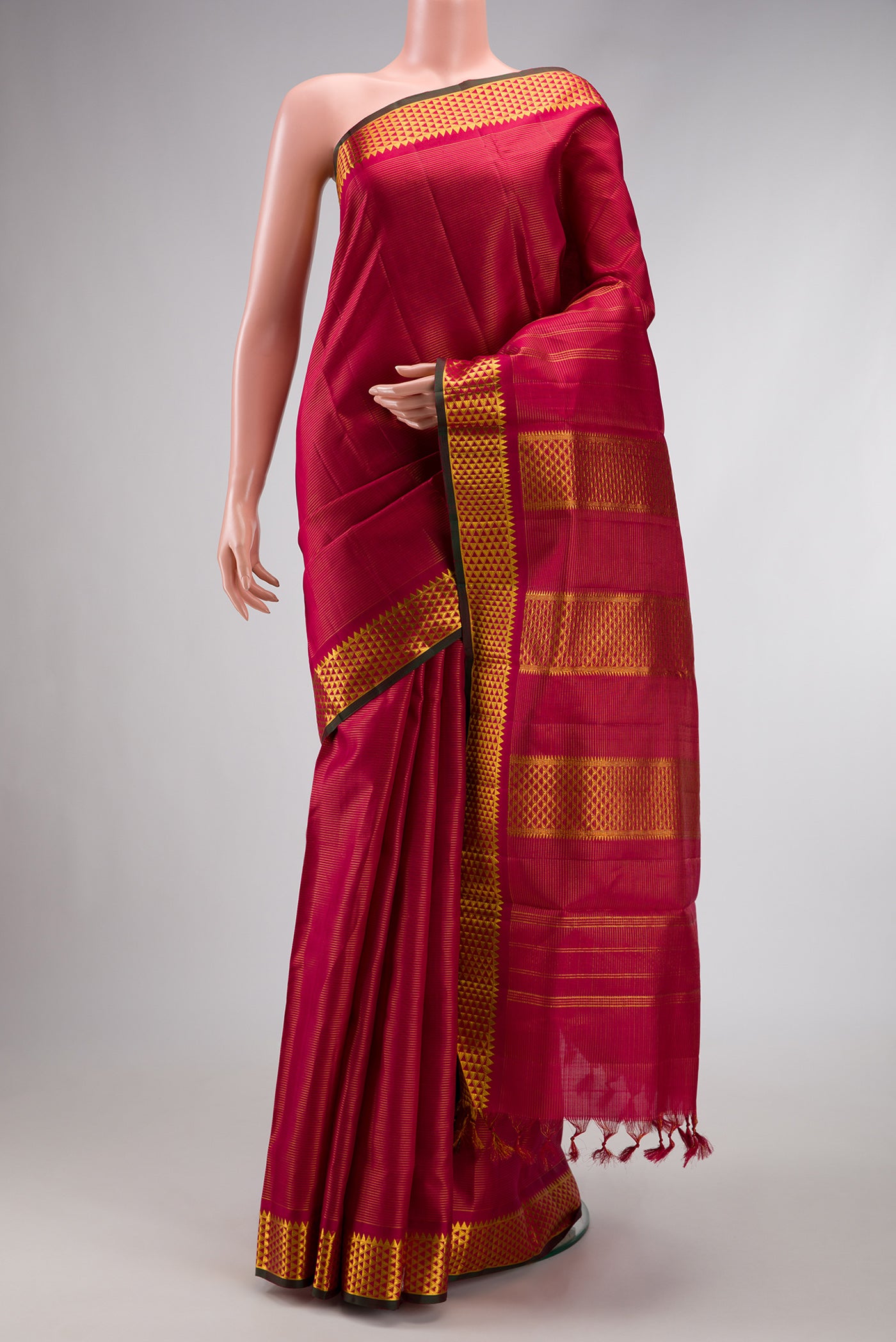 Pure Silk Pure Zari Maroon Dual Tone Kanchipuram Nine Yards Saree with Stripes on the body and Zari Border.  displayed on a mannequin