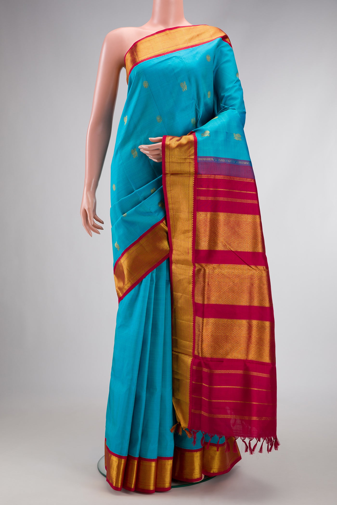 Pure Silk Pure Zari Sky Blue Dual Tone Kanchipuram Nine Yards Saree with Zari Butta on the body and Zari Border.  displayed on a mannequin