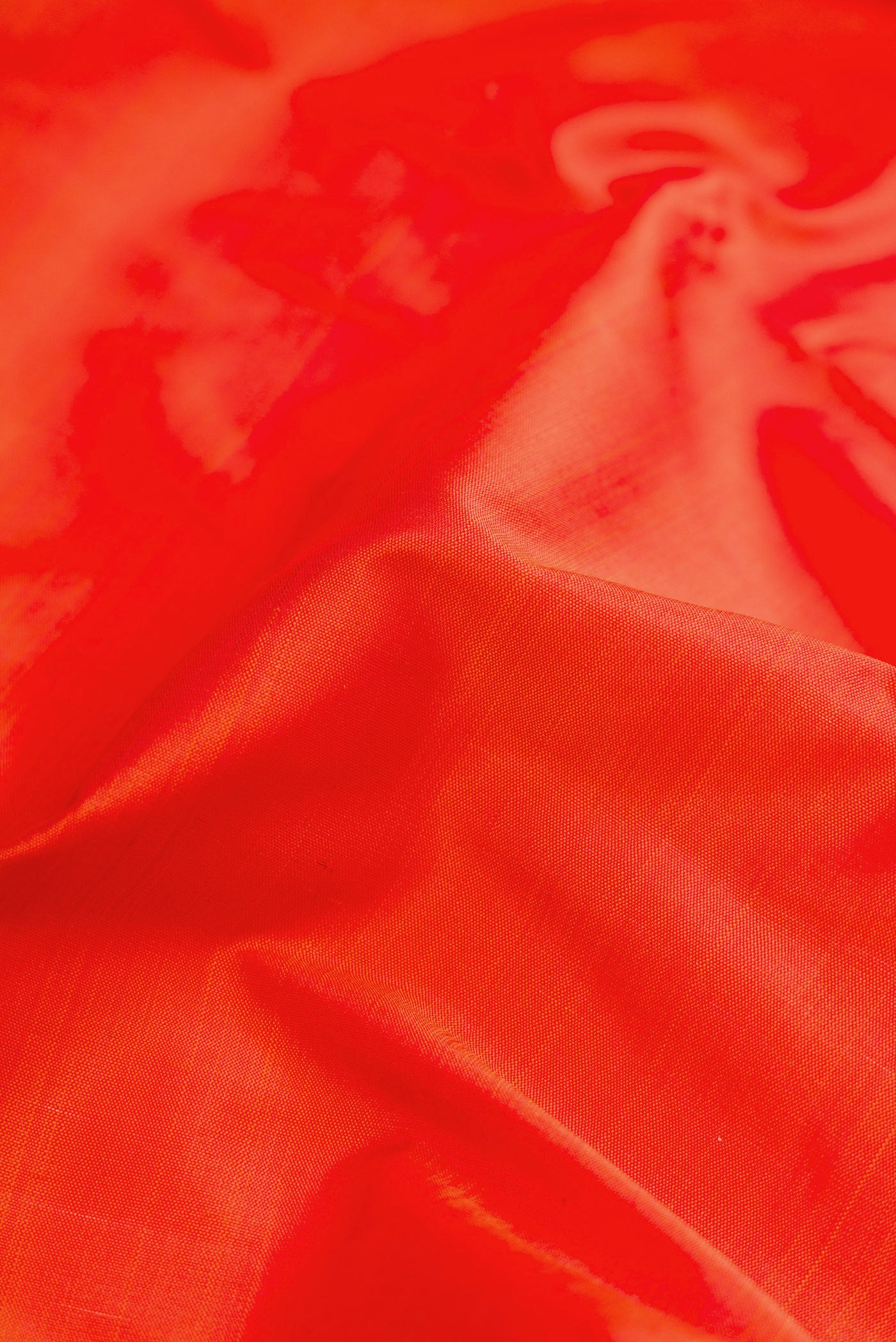 Close up of Orange Dual Tone Kanchipuram Silk Nine Yards Saree with Plain Body and Zari Border.  displaying folds
