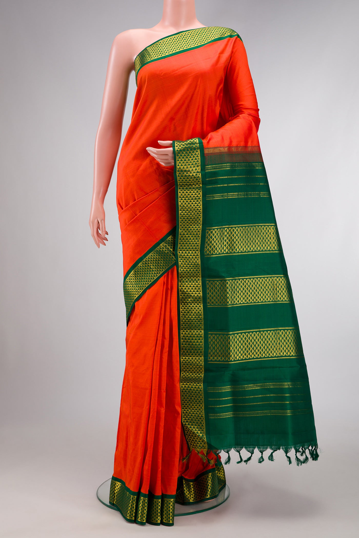 Orange Dual Tone Kanchipuram Silk Nine Yards Saree with Plain Body and Zari Border.  displayed on a mannequin
