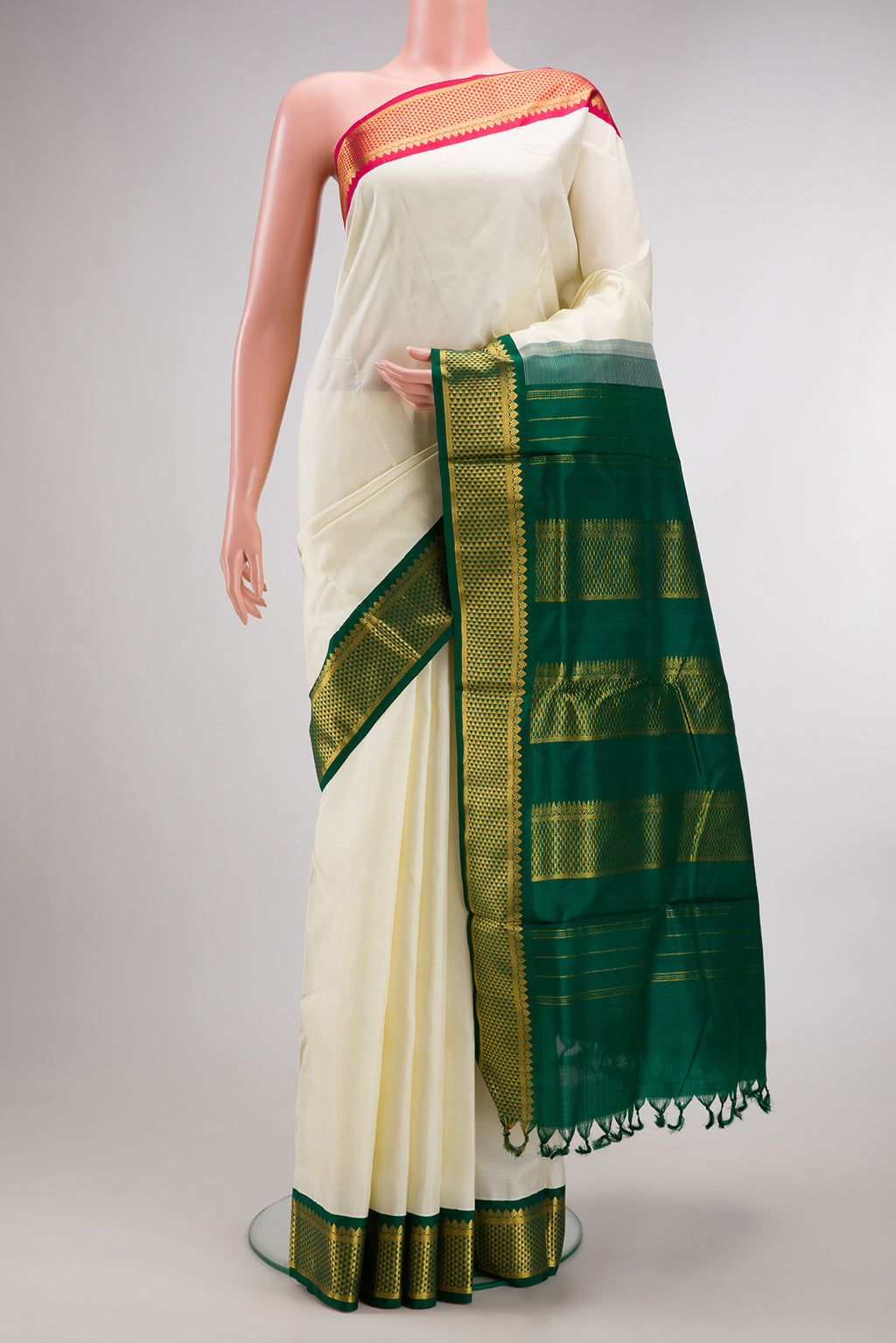 Pure Silk Off White Kanchipuram Nine Yards Saree with Plain Body and Ganga Jamuna Border.  displayed on a mannequin