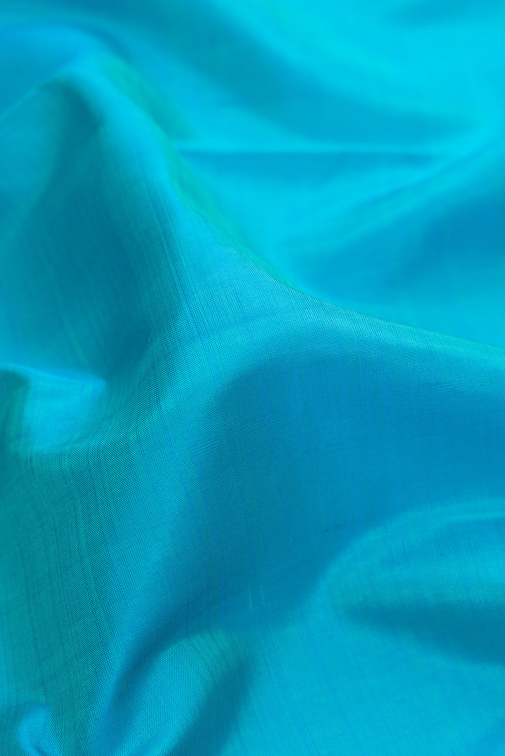 Close up of Pure Silk Pure Zari Sky Blue Dual Tone Kanchipuram Nine Yards Saree with Plain Body and Zari Border.  displaying folds