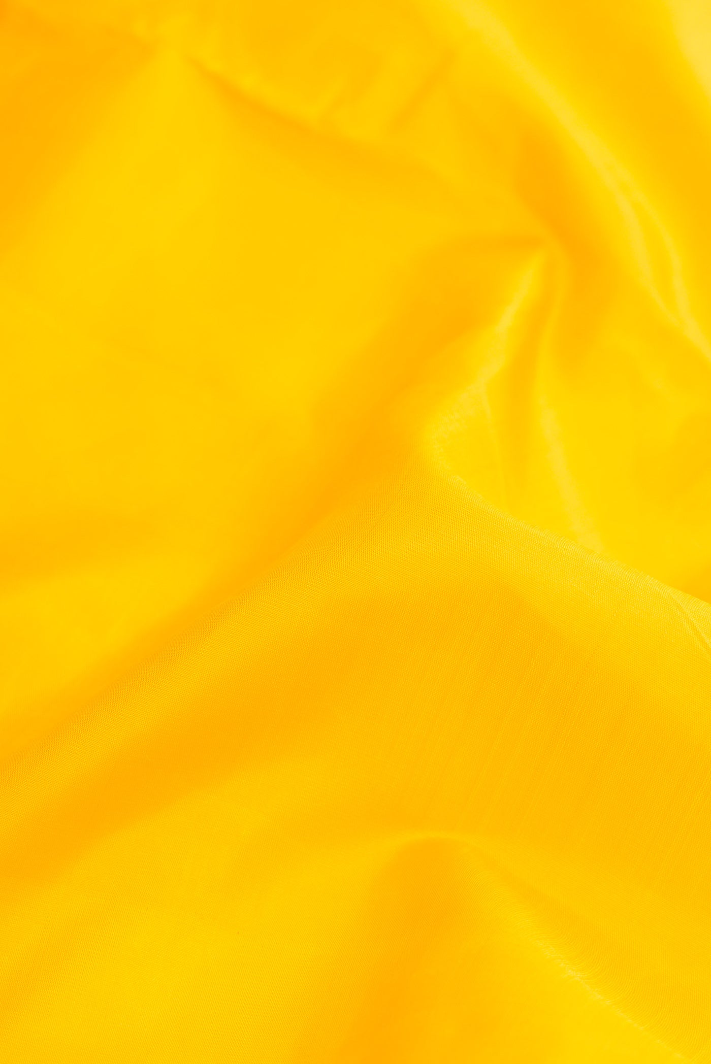 Close up of Pure Silk Pure Zari Yellow Dual Tone Kanchipuram Nine Yards Saree with Plain Body and Ganga Jamuna Border.  displaying folds