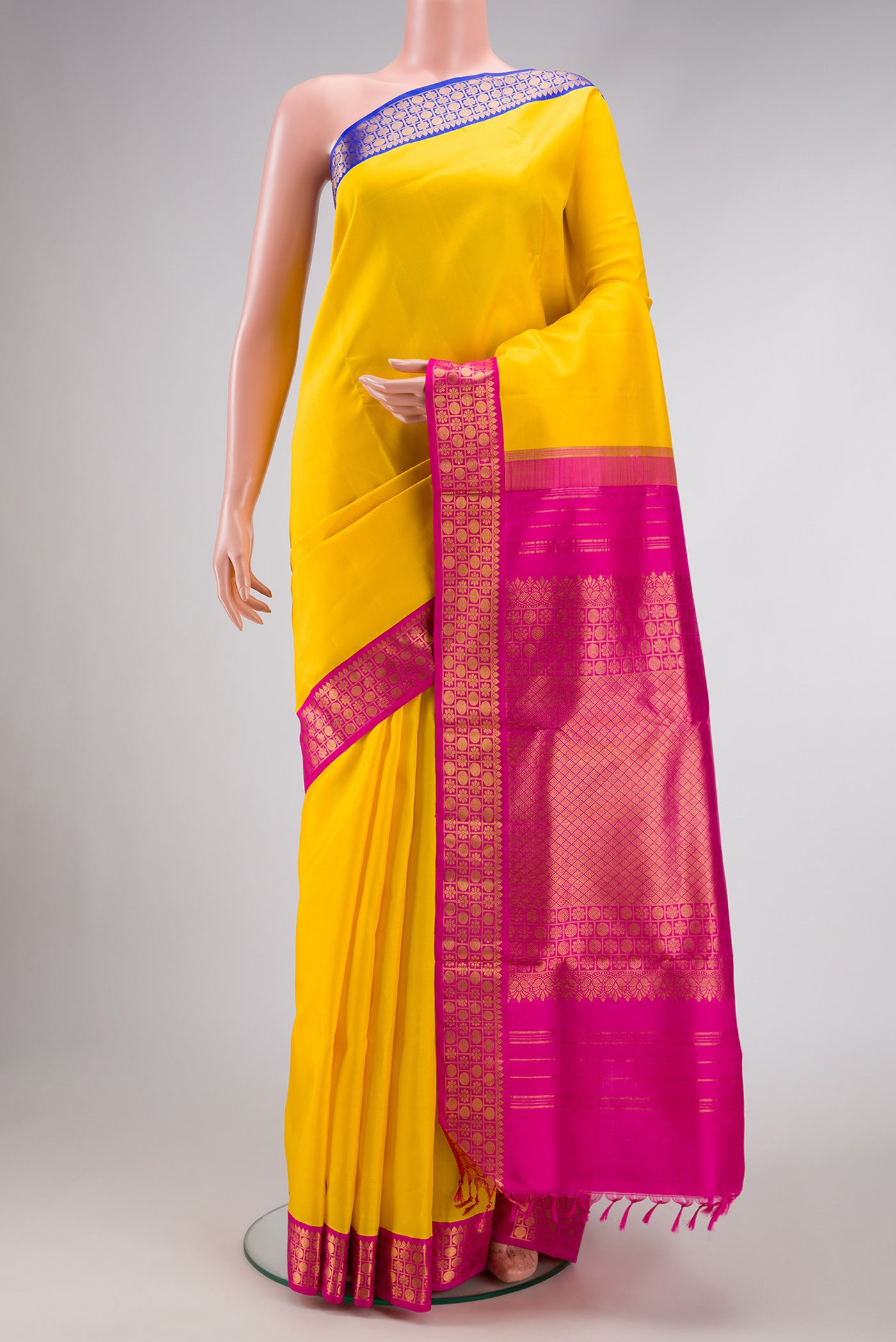 Pure Silk Pure Zari Yellow Dual Tone Kanchipuram Nine Yards Saree with Plain Body and Ganga Jamuna Border.  displayed on a mannequin