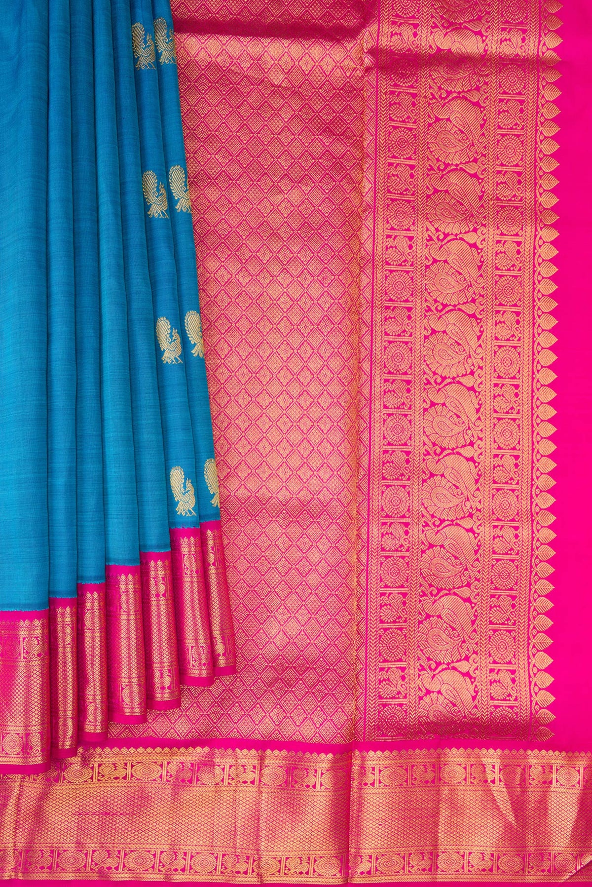 Pleats and pallu of Pure Silk Pure Zari Peacock Blue Dual Tone Kanchipuram Nine Yards Saree with Zari Butta on the body and Zari Border. 