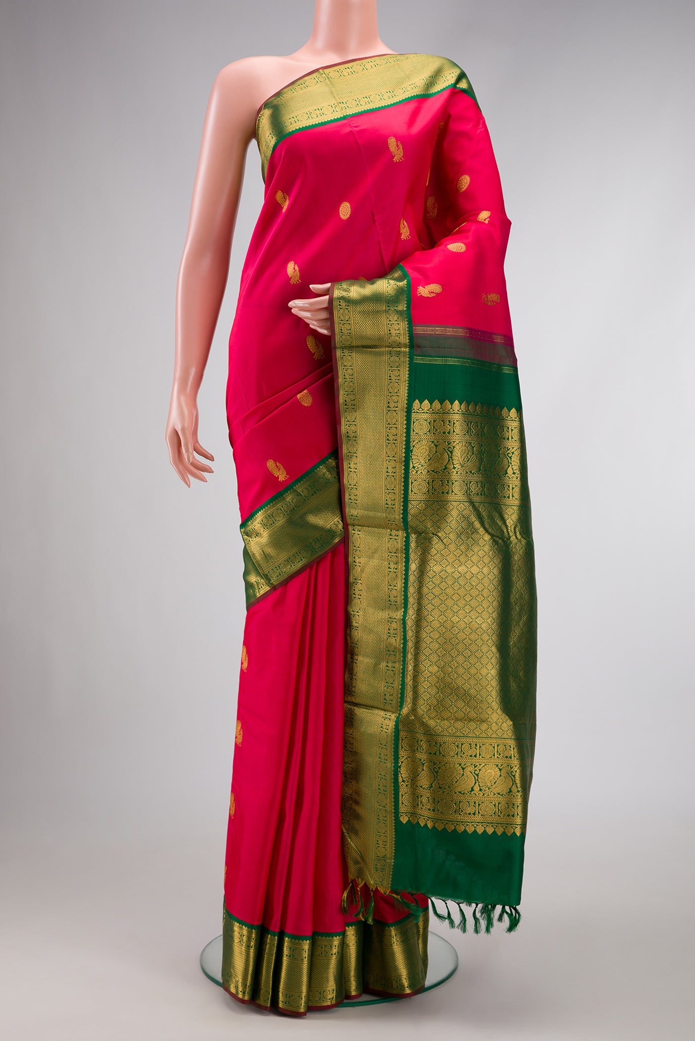 Pure Silk Pure Zari Dark Pink Dual Tone Kanchipuram Nine Yards Saree with Zari Butta on the body and Zari Border.  displayed on a mannequin