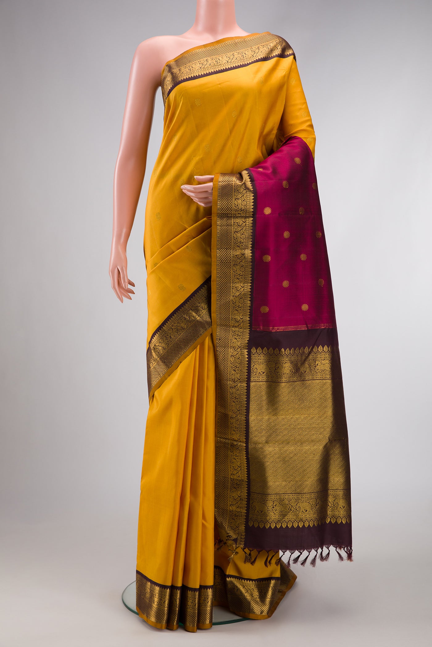 Pure Silk Pure Zari Yellow Dual Tone Kanchipuram Nine Yards Saree with Zari Butta on the body and Zari Border.  displayed on a mannequin