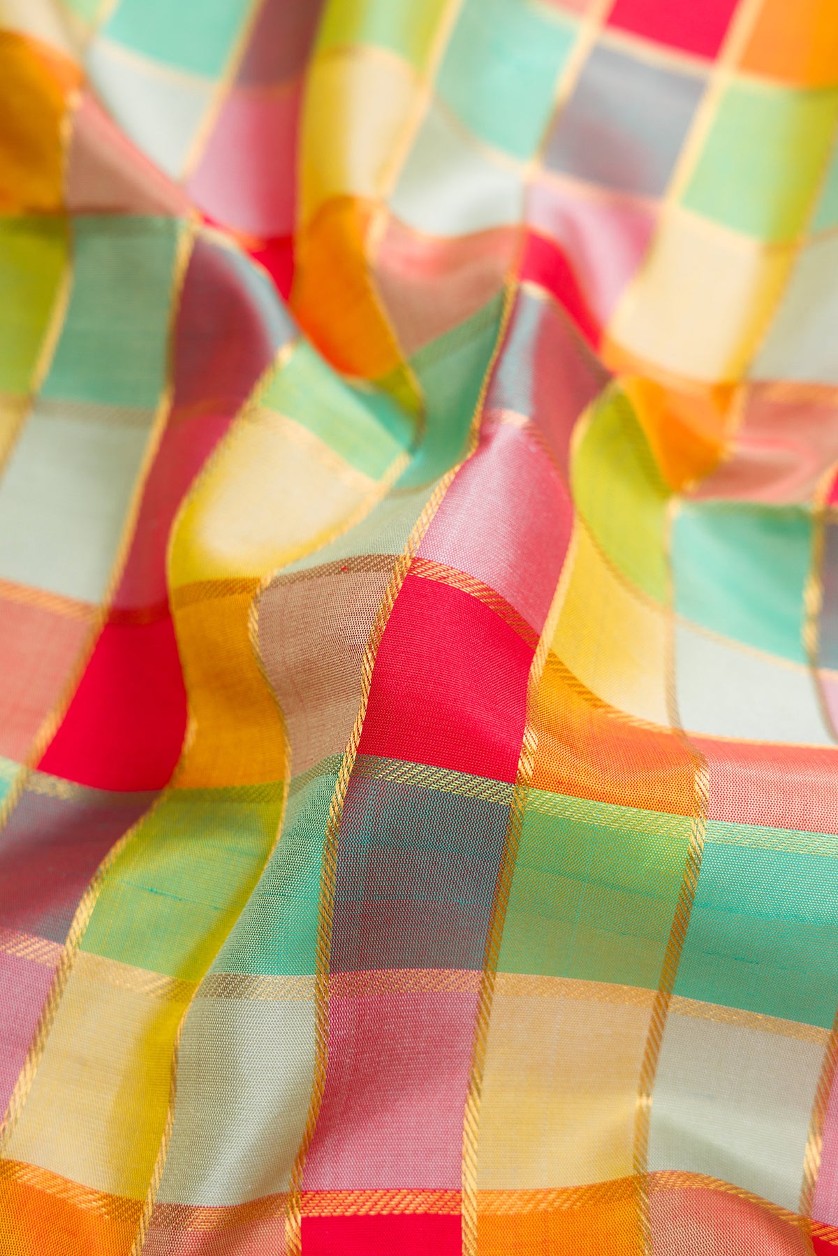 Close up of Red, Mustard, Green & pink Color Kanchipuram Silk Nine Yards Saree with Checked design on the body and Zari Border.  displaying folds