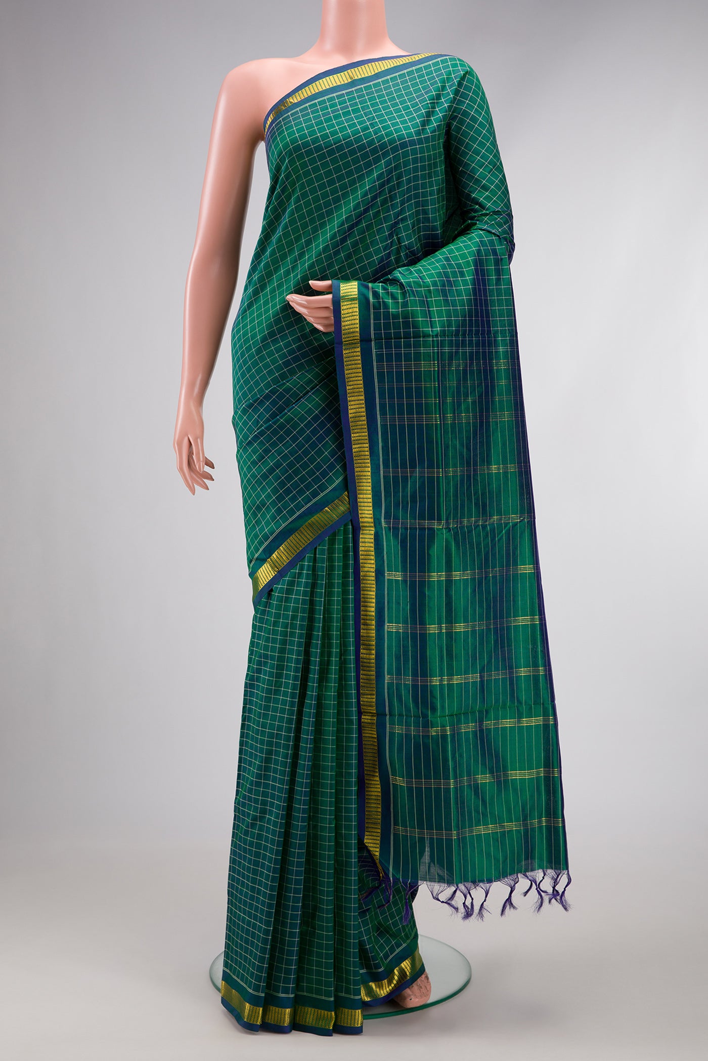 Green Dual Tone Kanchipuram Silk Nine Yards Saree with Checked design on the body and Zari Border.  displayed on a mannequin