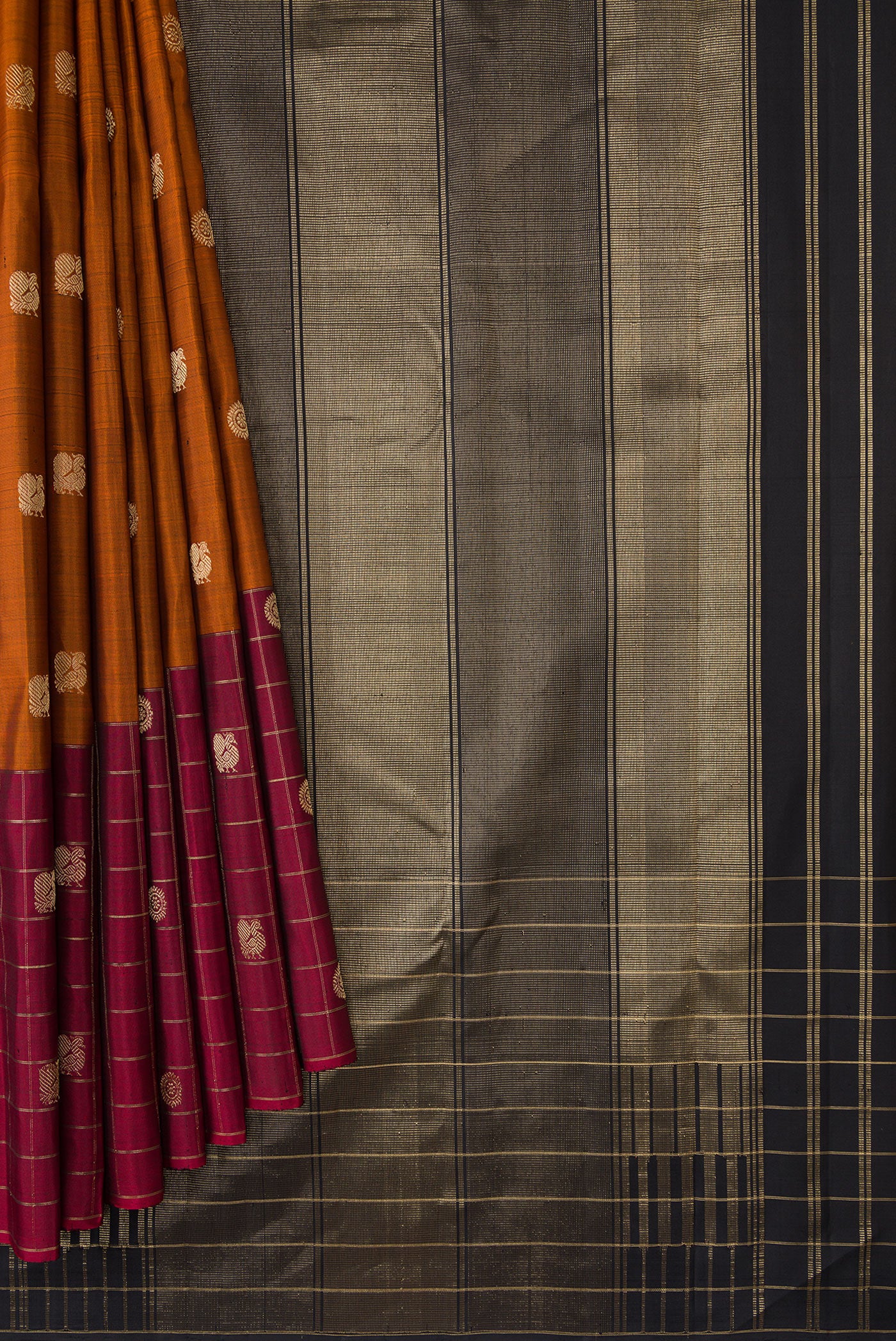 Pleats and pallu of Brick Orange Dual Tone Kanjivaram Silk Saree with Zari Butta on the body and Ganga Jamuna Border. 