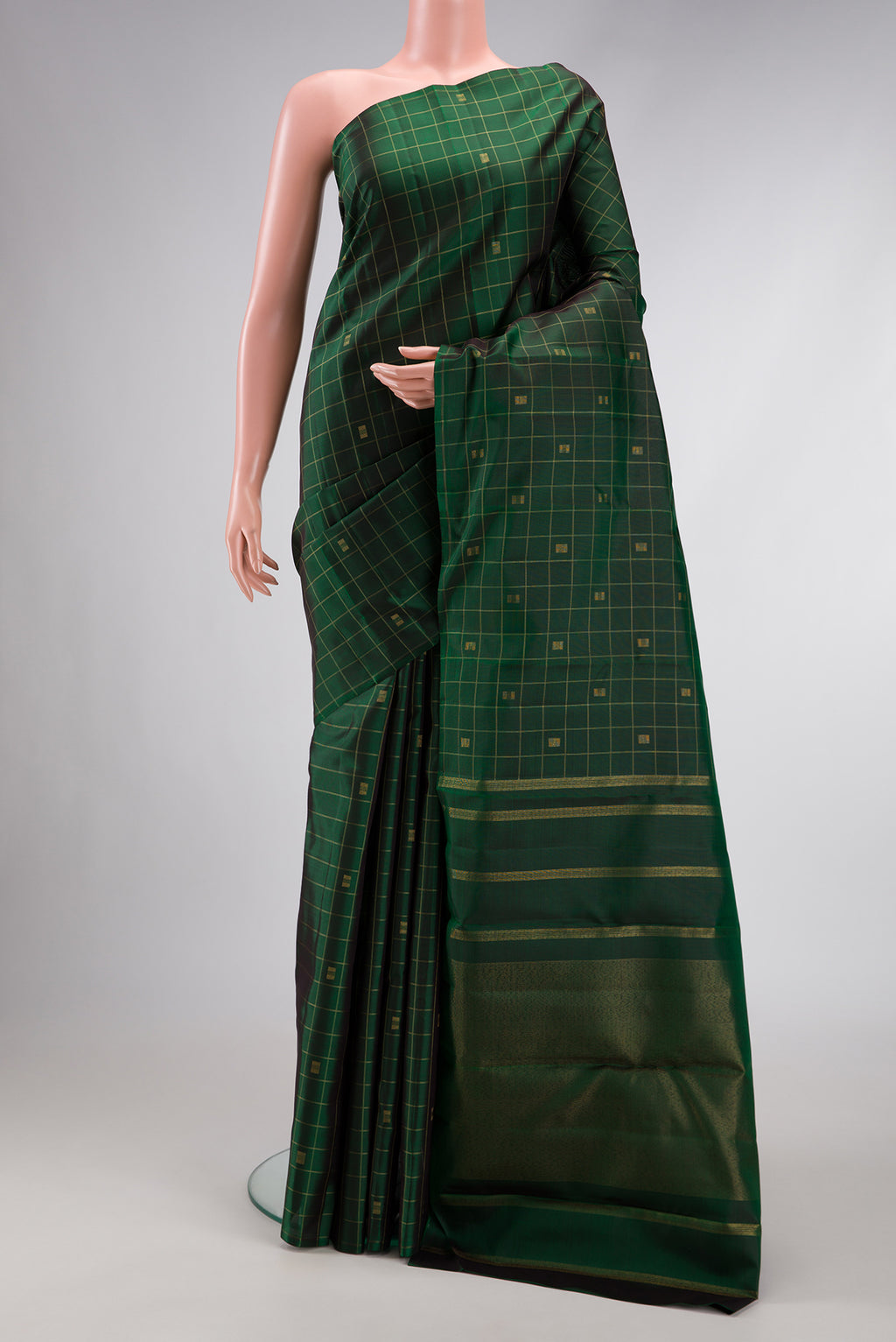 Pure Silk Pure Zari Green Dual Tone Kanjivaram Saree with Checked design on the body and Without Border.  displayed on a mannequin