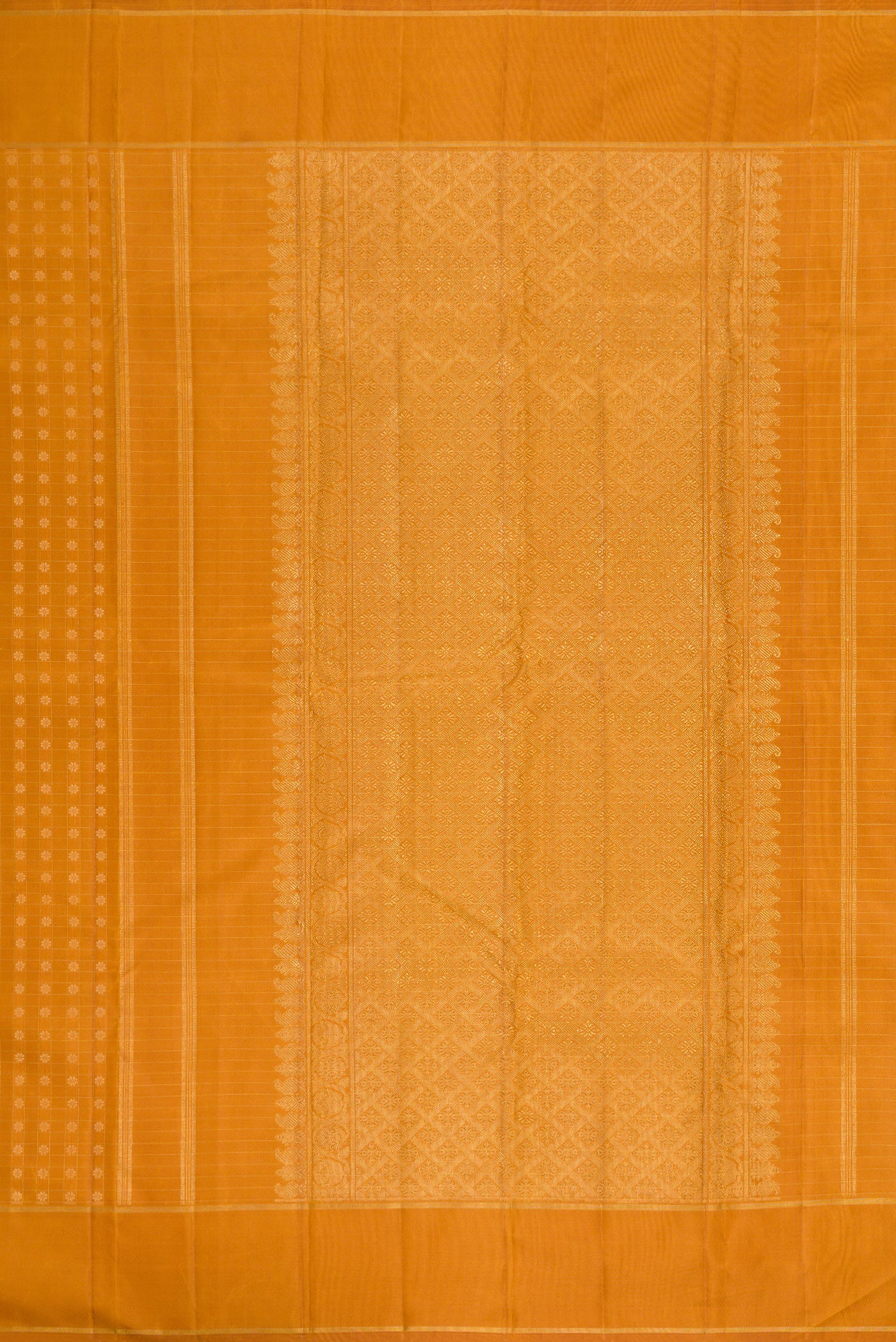 Close up image of the pallu of Mustard Dual Tone Kanchipuram Silk Saree with Zari Butta on the body and Zari Border. 
