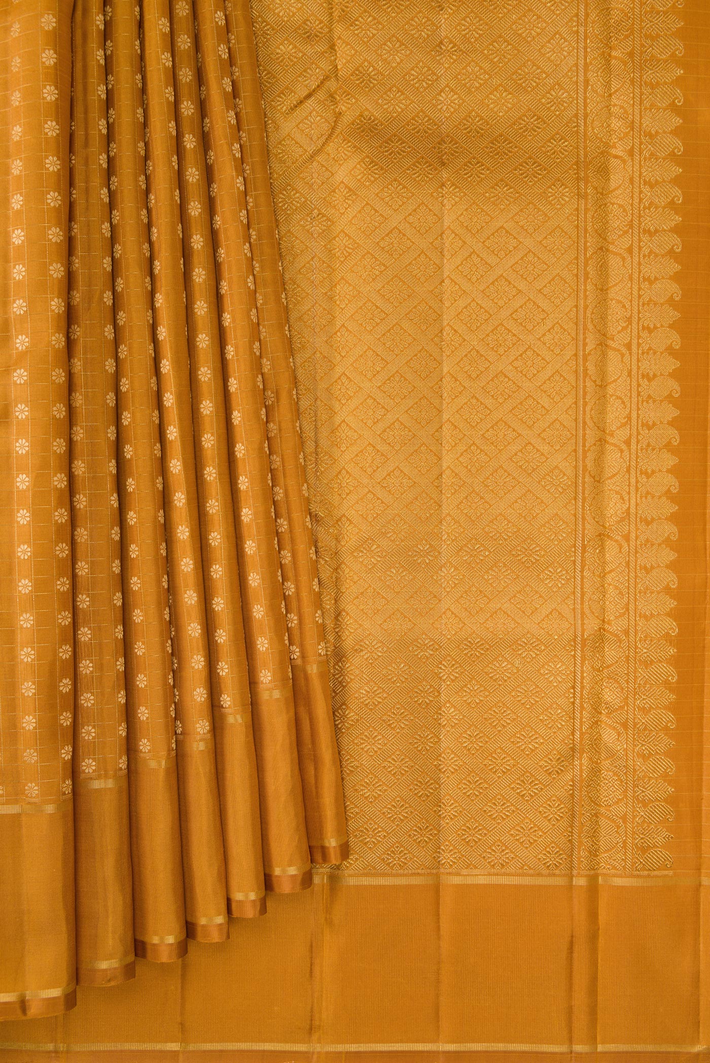 Pleats and pallu of Mustard Dual Tone Kanchipuram Silk Saree with Zari Butta on the body and Zari Border. 