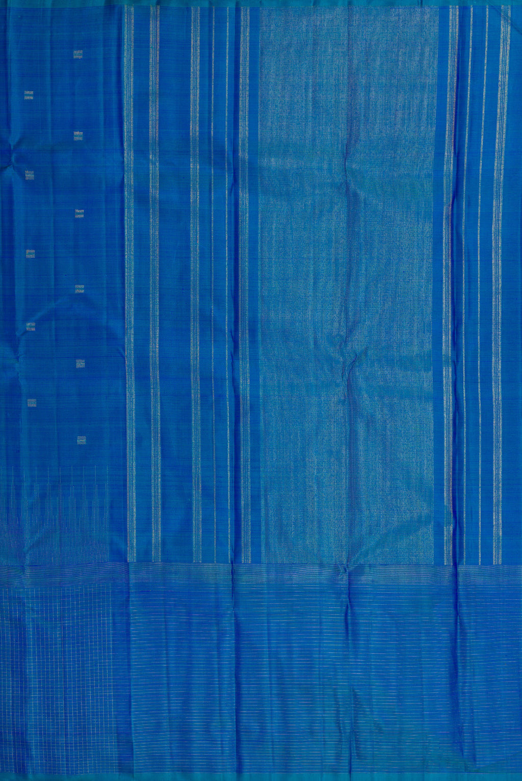 Close up image of the pallu of Pure Silk Pure Zari Peacock Blue Dual Tone Kanchipuram Saree with Zari Butta on the body and Zari Border. 