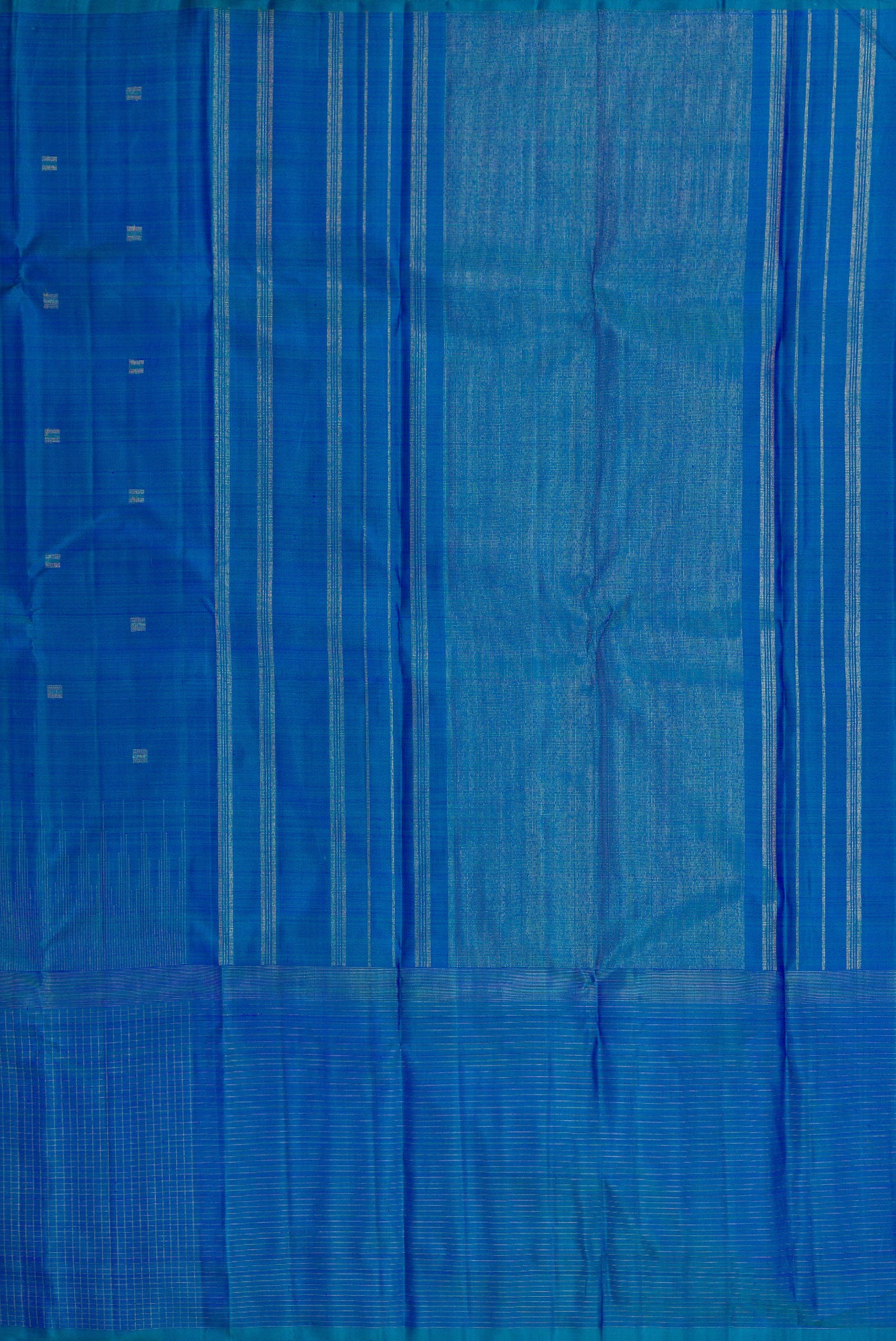 Close up image of the pallu of Pure Silk Pure Zari Peacock Blue Dual Tone Kanchipuram Saree with Zari Butta on the body and Zari Border. 