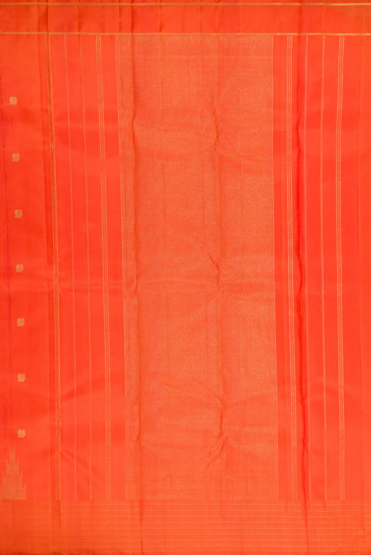 Close up image of the pallu of Pure Silk Pure Zari Orange Kanchipuram Saree with Zari Butta on the body and Fancy Border. 