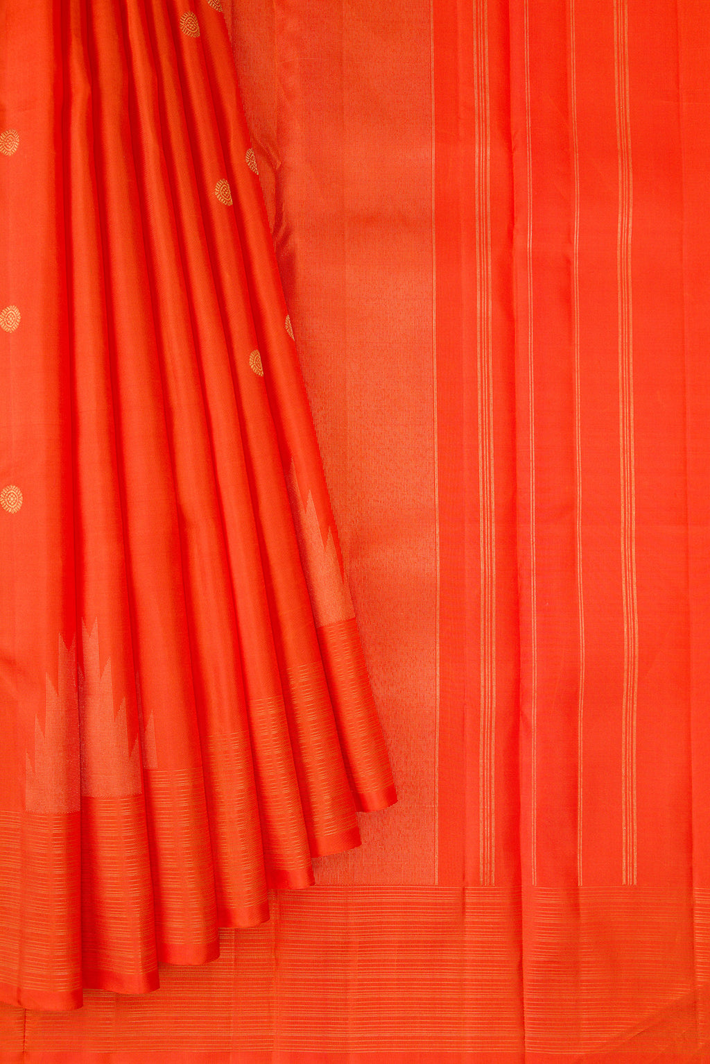 Pleats and pallu of Pure Silk Pure Zari Orange Kanchipuram Saree with Zari Butta on the body and Fancy Border. 