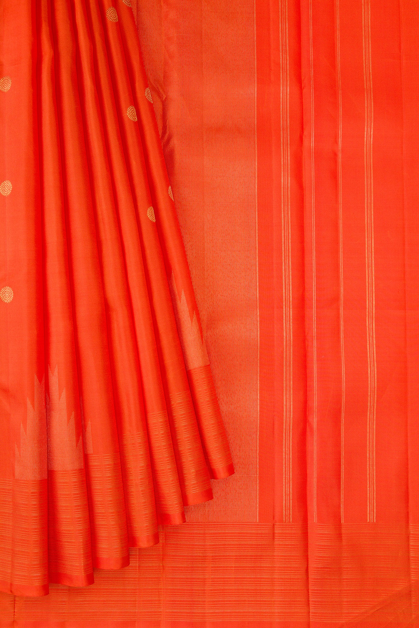 Pleats and pallu of Pure Silk Pure Zari Orange Kanchipuram Saree with Zari Butta on the body and Fancy Border. 