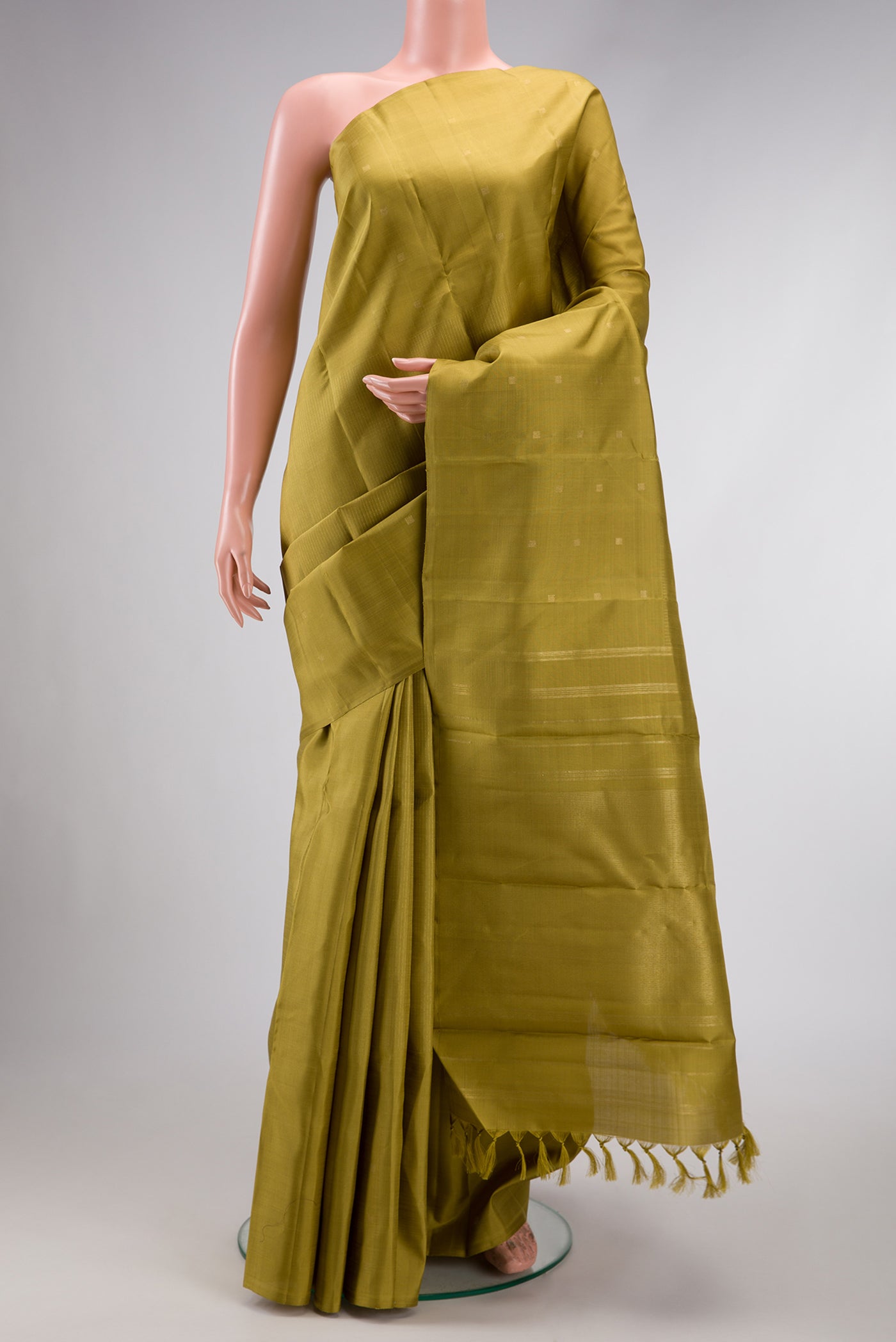 Mehandi Green Dual Tone Kanchipuram Silk Saree with Stripes on the body and Fancy Border.  displayed on a mannequin