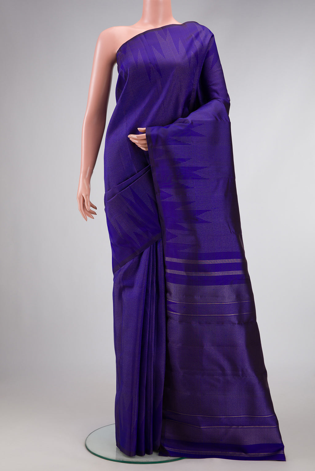 Pure Silk Pure Zari Navy Blue Dual Tone Kanchipuram Saree with Stripes on the body and Fancy Border.  displayed on a mannequin