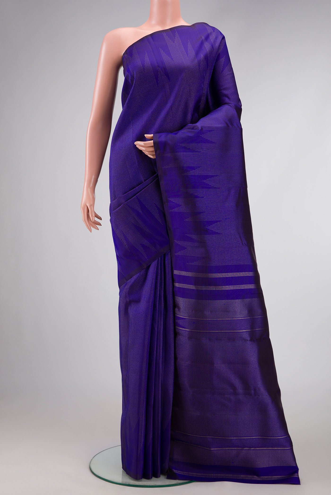 Pure Silk Pure Zari Navy Blue Dual Tone Kanchipuram Saree with Stripes on the body and Fancy Border.  displayed on a mannequin