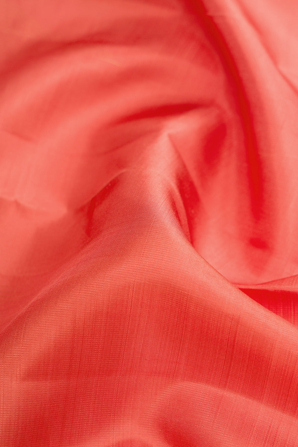 Close up of Pure Silk Pure Zari Golden Peach Dual Tone Kanjivaram Saree with Stripes on the body and Fancy Border.  displaying folds