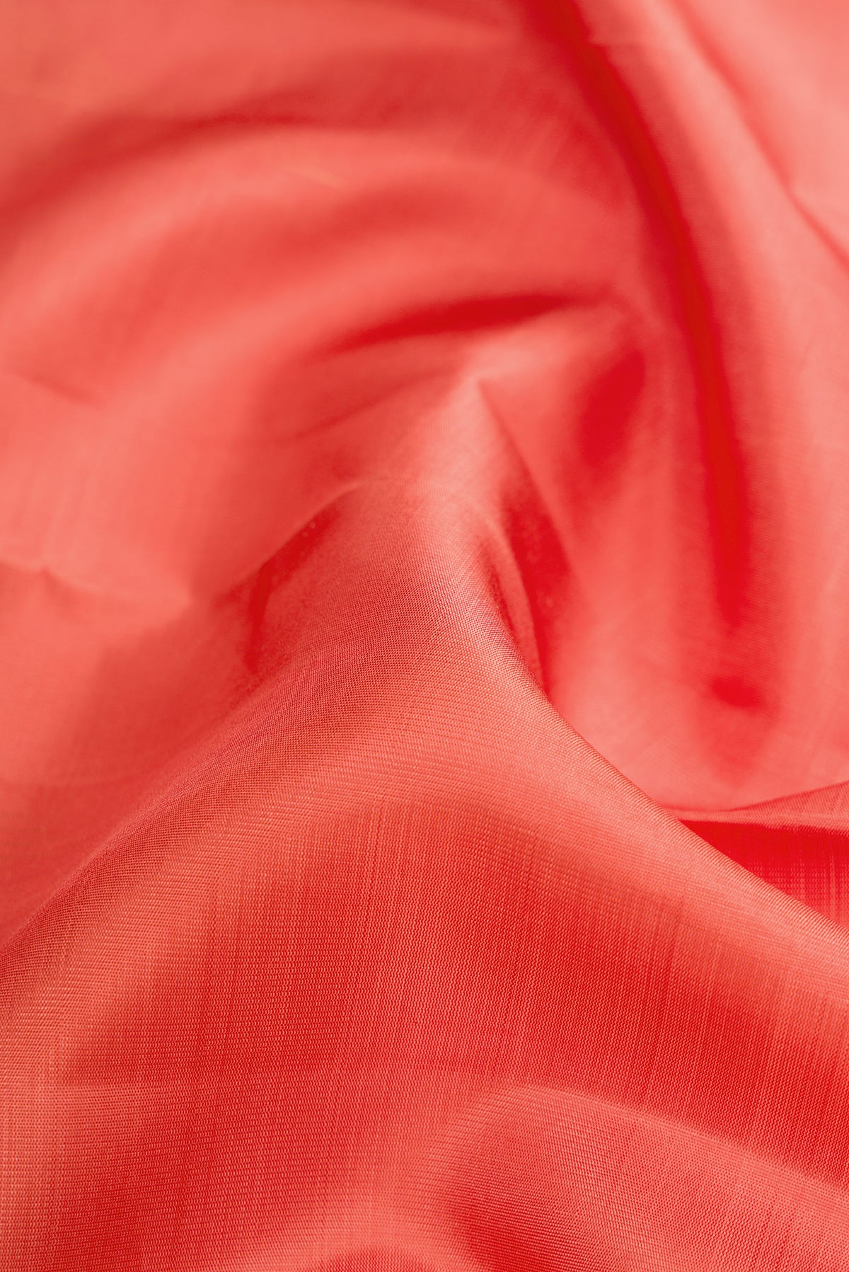 Close up of Pure Silk Pure Zari Golden Peach Dual Tone Kanjivaram Saree with Stripes on the body and Fancy Border.  displaying folds