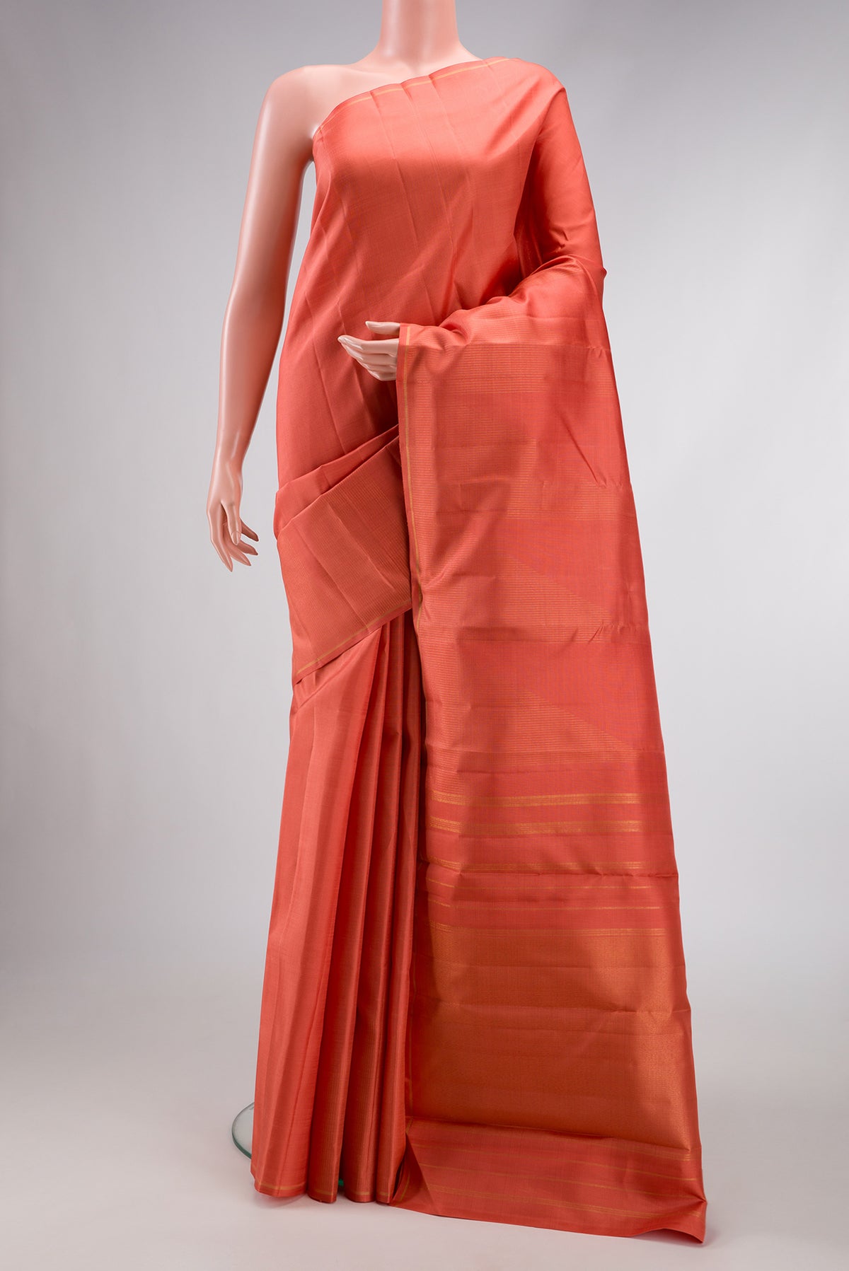 Pure Silk Pure Zari Golden Peach Dual Tone Kanjivaram Saree with Stripes on the body and Fancy Border.  displayed on a mannequin