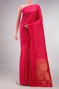 Pink Dual Tone Kanchipuram Silk Saree with Stripes on the body and Zari Border.  displayed on a mannequin