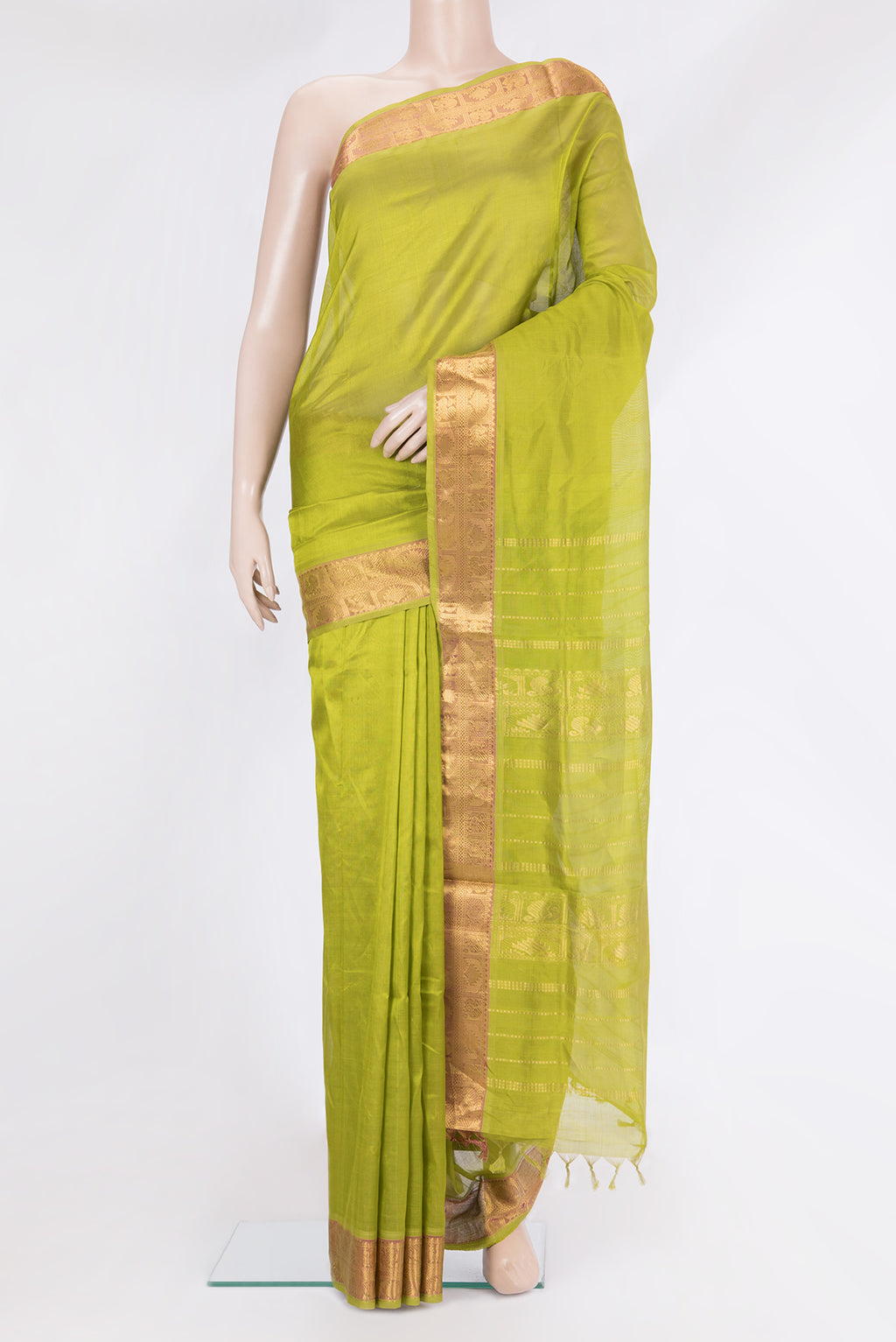Green Silk Cotton Saree with Plain Body and Zari Border.  displayed on a mannequin