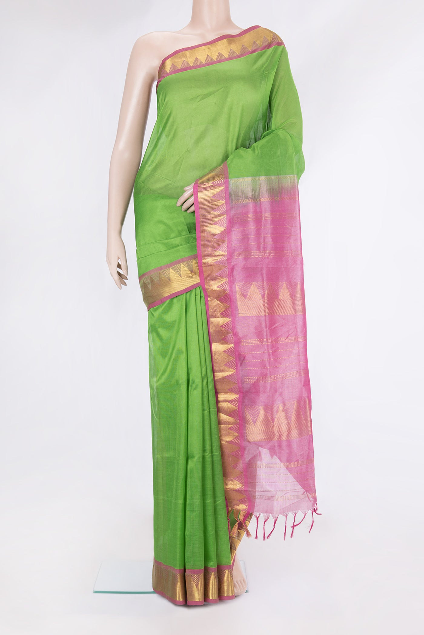 Green Silk Cotton Saree with Plain Body and Zari Border.  displayed on a mannequin