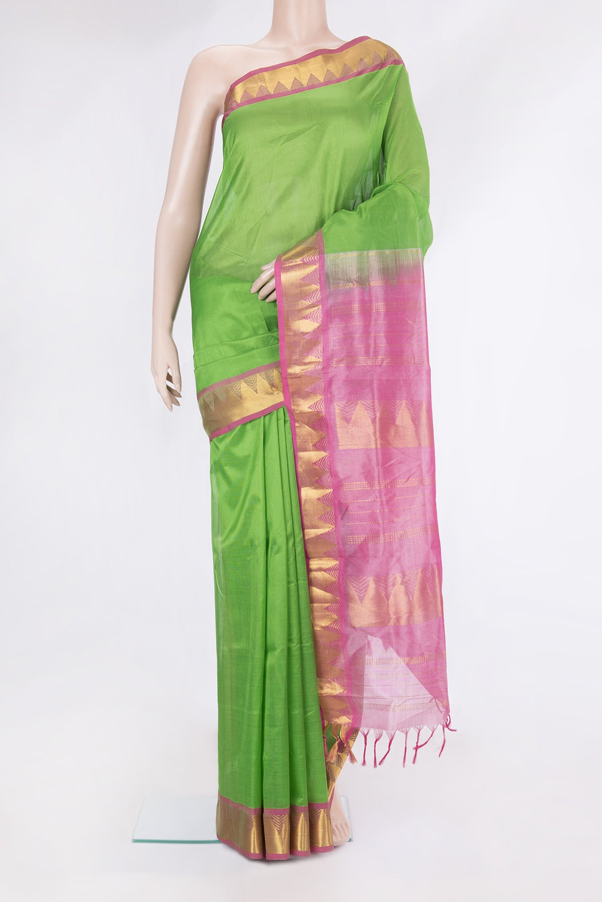 Green Silk Cotton Saree with Plain Body and Zari Border.  displayed on a mannequin