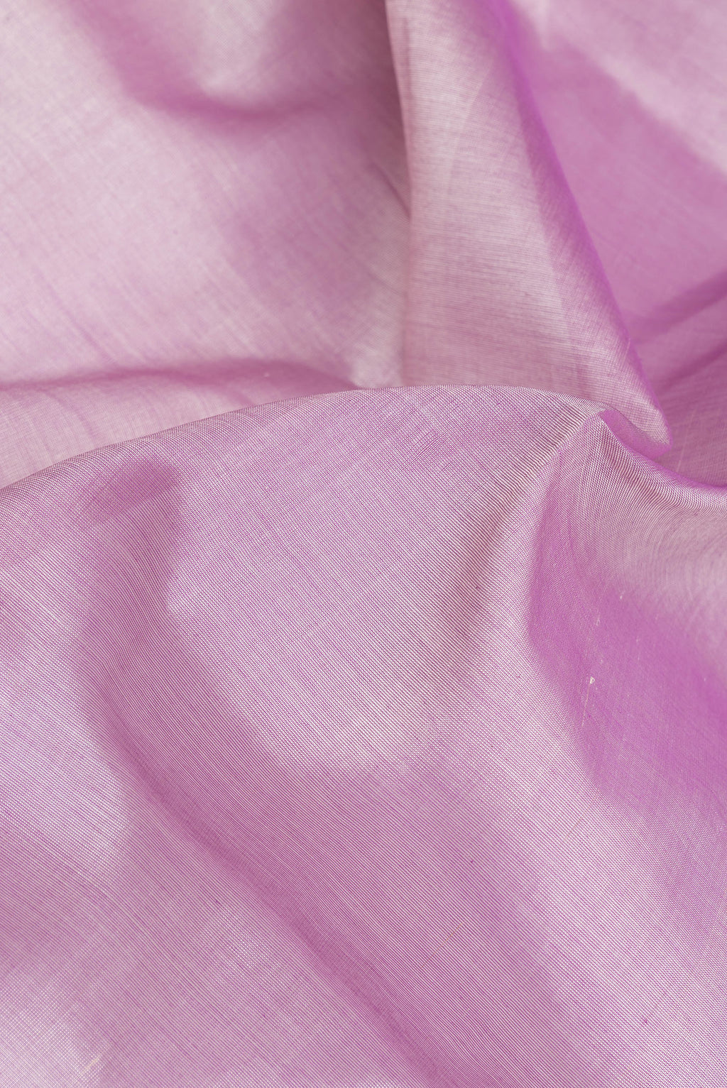 Close up of Lavender Silk Cotton Saree with Plain Body and Zari Border.  displaying folds