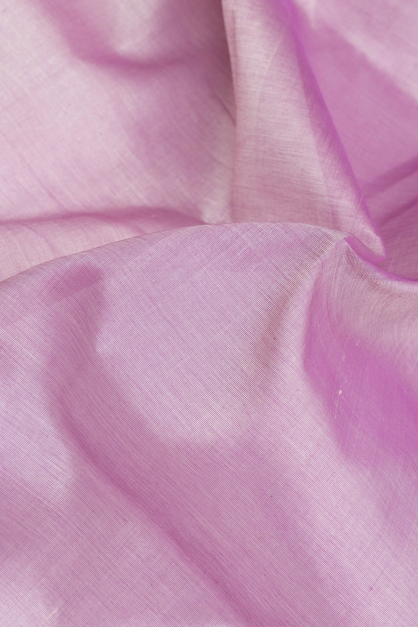 Close up of Lavender Silk Cotton Saree with Plain Body and Zari Border.  displaying folds