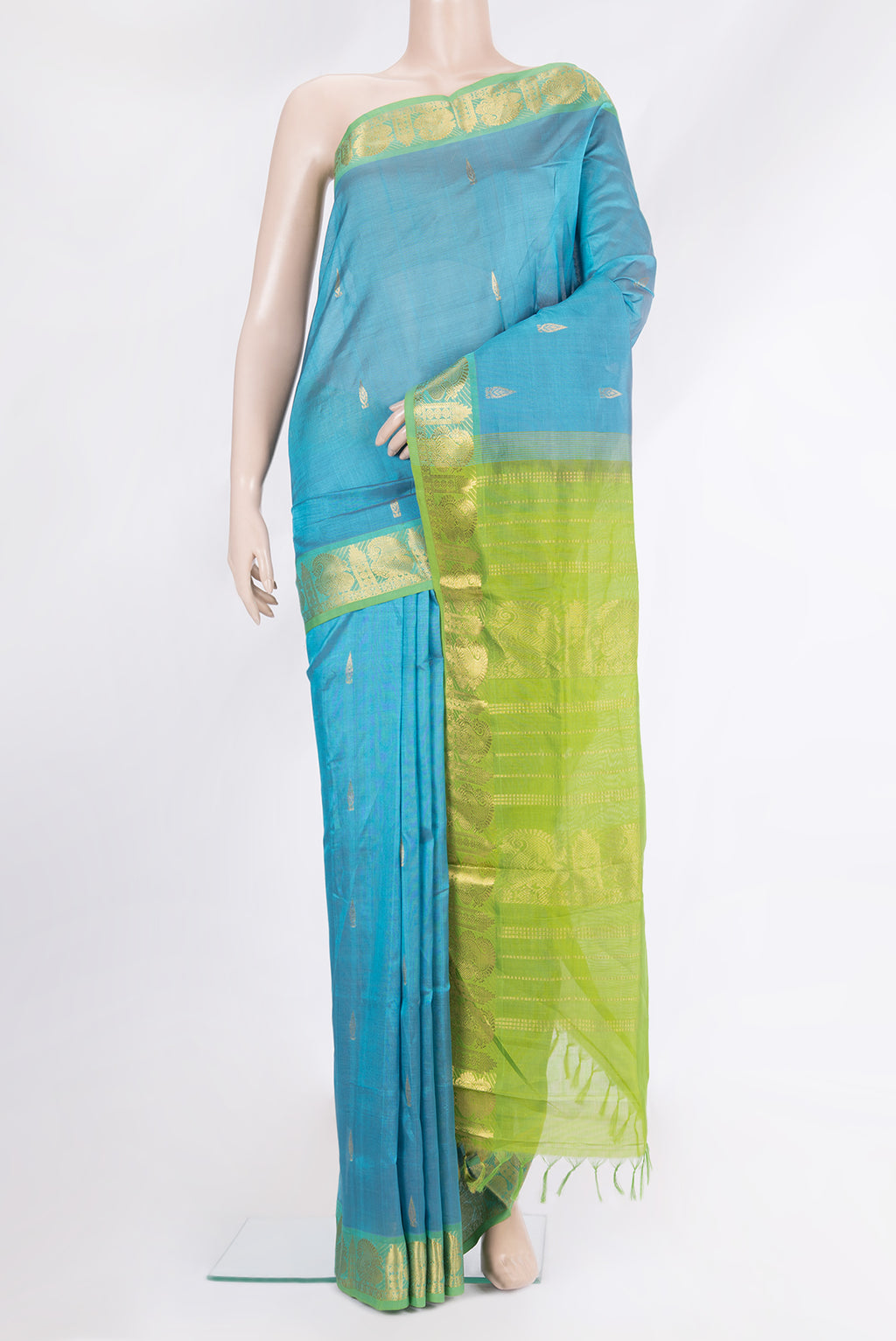 Sky Blue Silk Cotton Saree with Zari Butta on the body and Zari Border.  displayed on a mannequin