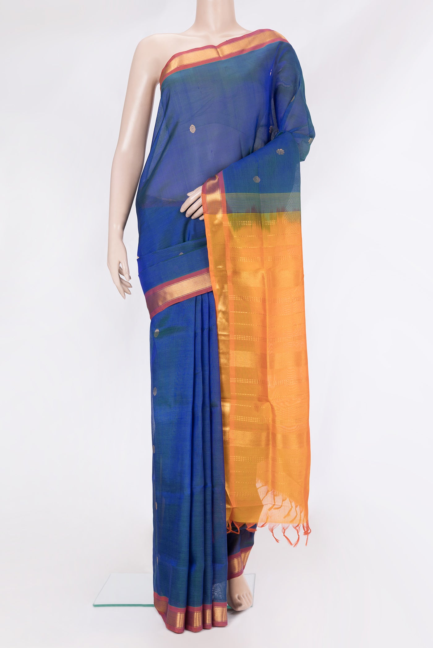 Peacock Blue Silk Cotton Saree with Zari Butta on the body and Zari Border.  displayed on a mannequin