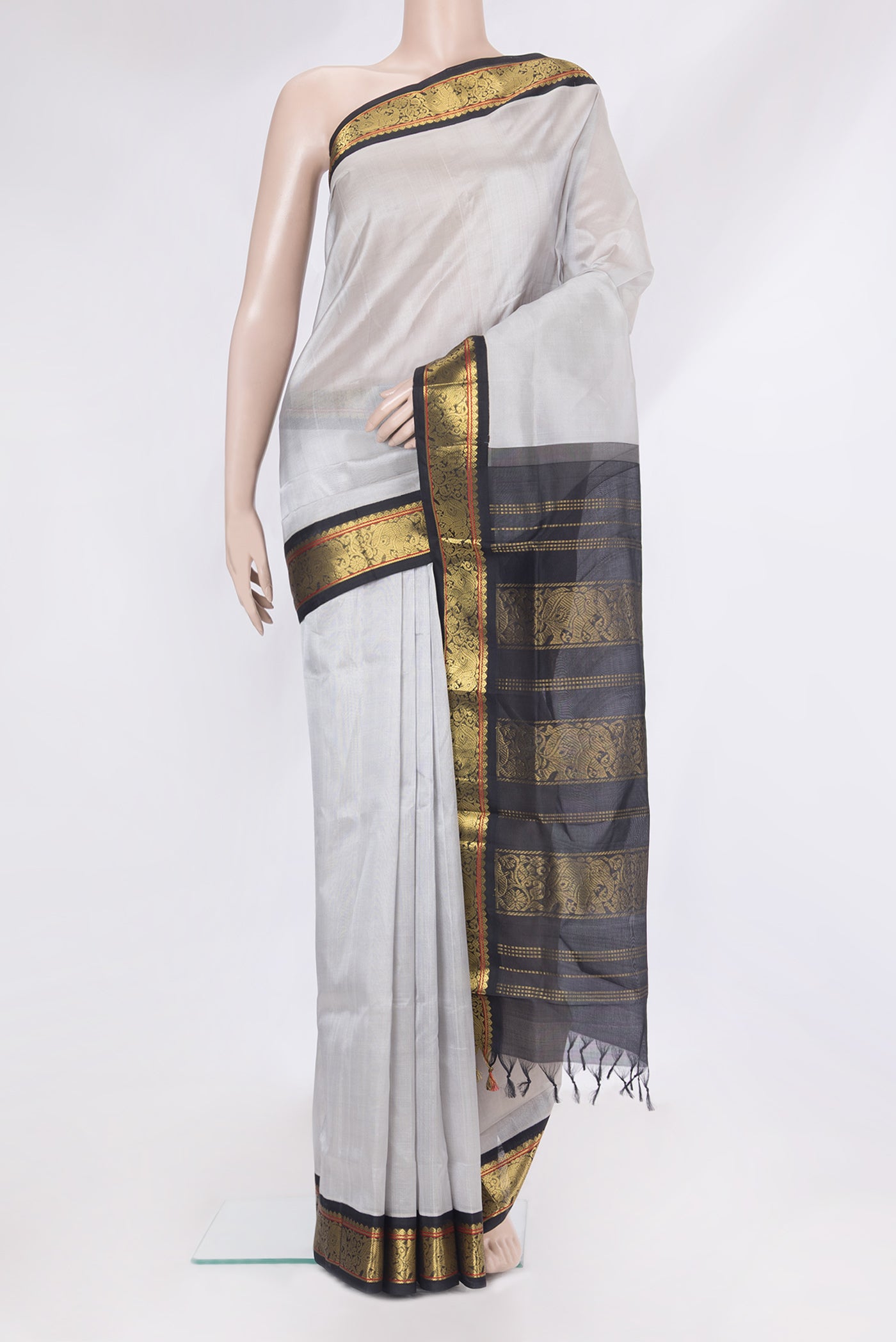 Grey Silk Cotton Saree with Plain Body and Zari Border.  displayed on a mannequin