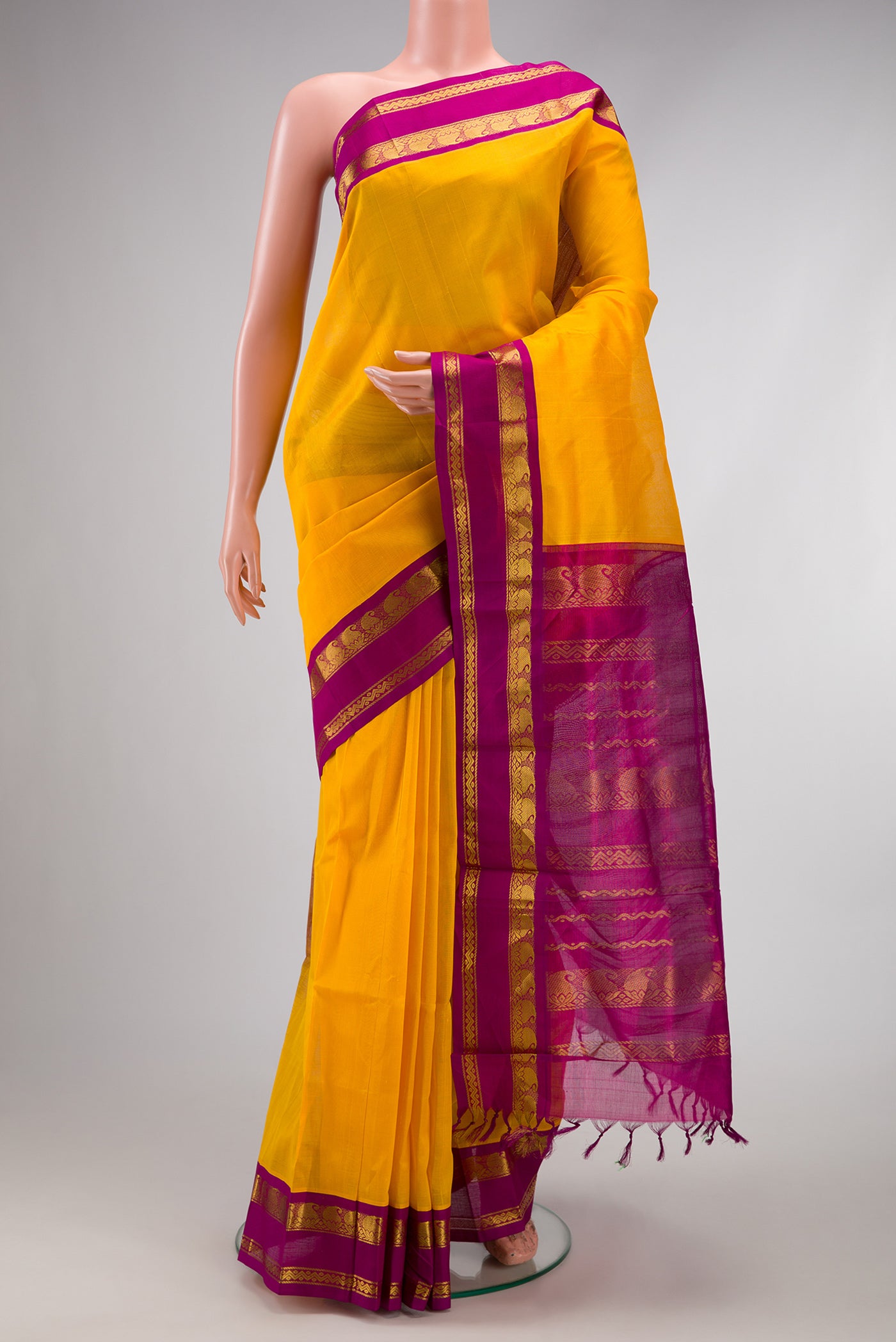 Yellow Dual Tone Silk Cotton Saree with Plain Body and Zari Border.  displayed on a mannequin