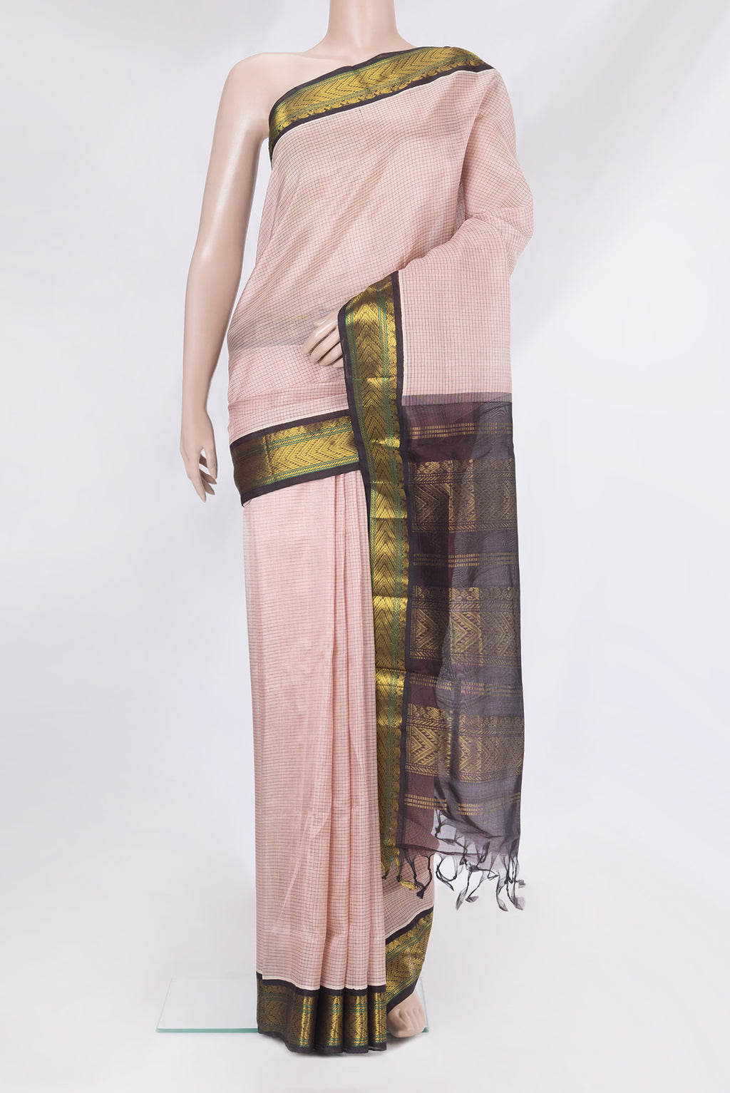 Rose Gold Silk Cotton Saree with Checked design on the body and Zari Border.  displayed on a mannequin