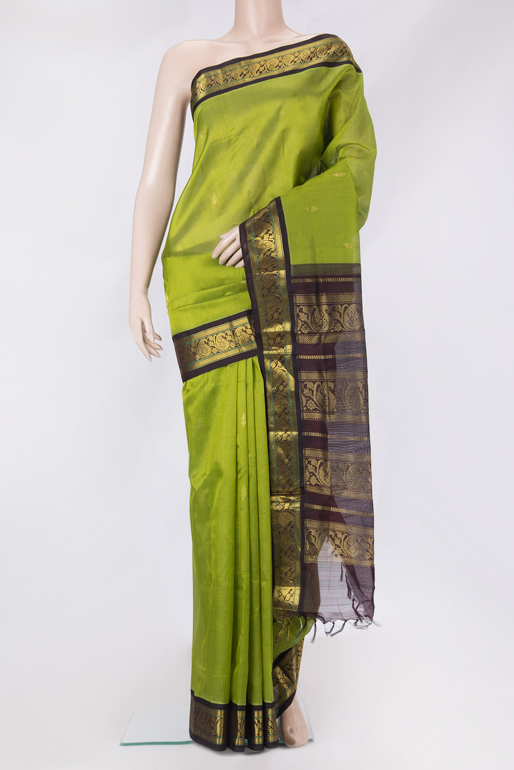 Green Dual Tone Silk Cotton Saree with Zari Butta on the body and Zari Border.  displayed on a mannequin